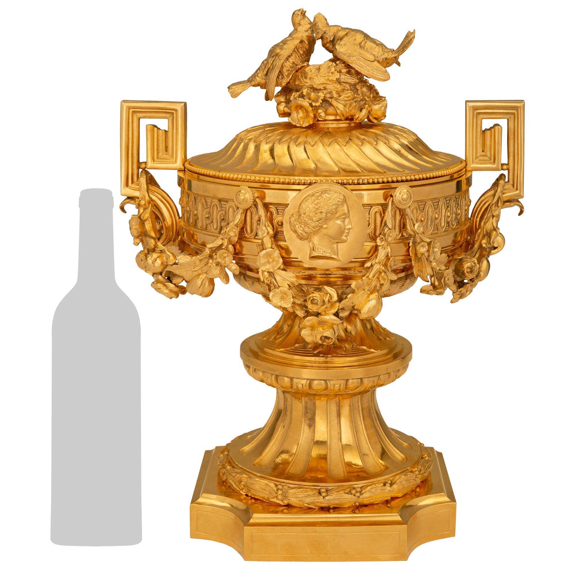 A stunning and extremely high quality pair of French 19th century Louis XVI st. Napoleon III period ormolu lidded urns, attributed to Paul Sormani. Each impressive and large scale urn is raised by a square base with elegant concave corners and a