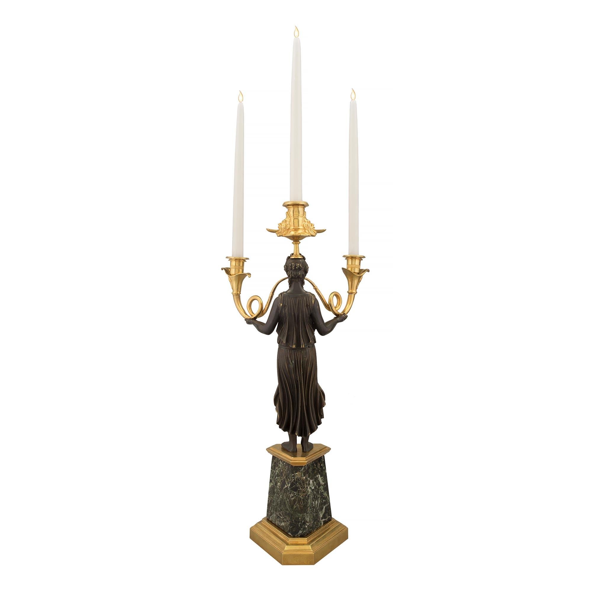 Patinated Pair of French 19th Century Neo-Classical St. Candelabras For Sale