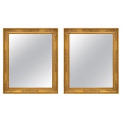 Paire de miroirs en bois doré de style néo-classique français du 19ème siècle