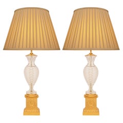pair of French 19th century Neo-Classical st. Ormolu and Crystal lamps