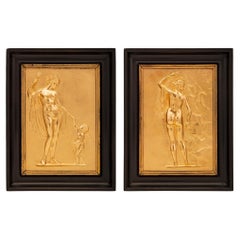 Pair of French 19th Century Neo-Classical St. Ormolu and Ebony Wall Plaques