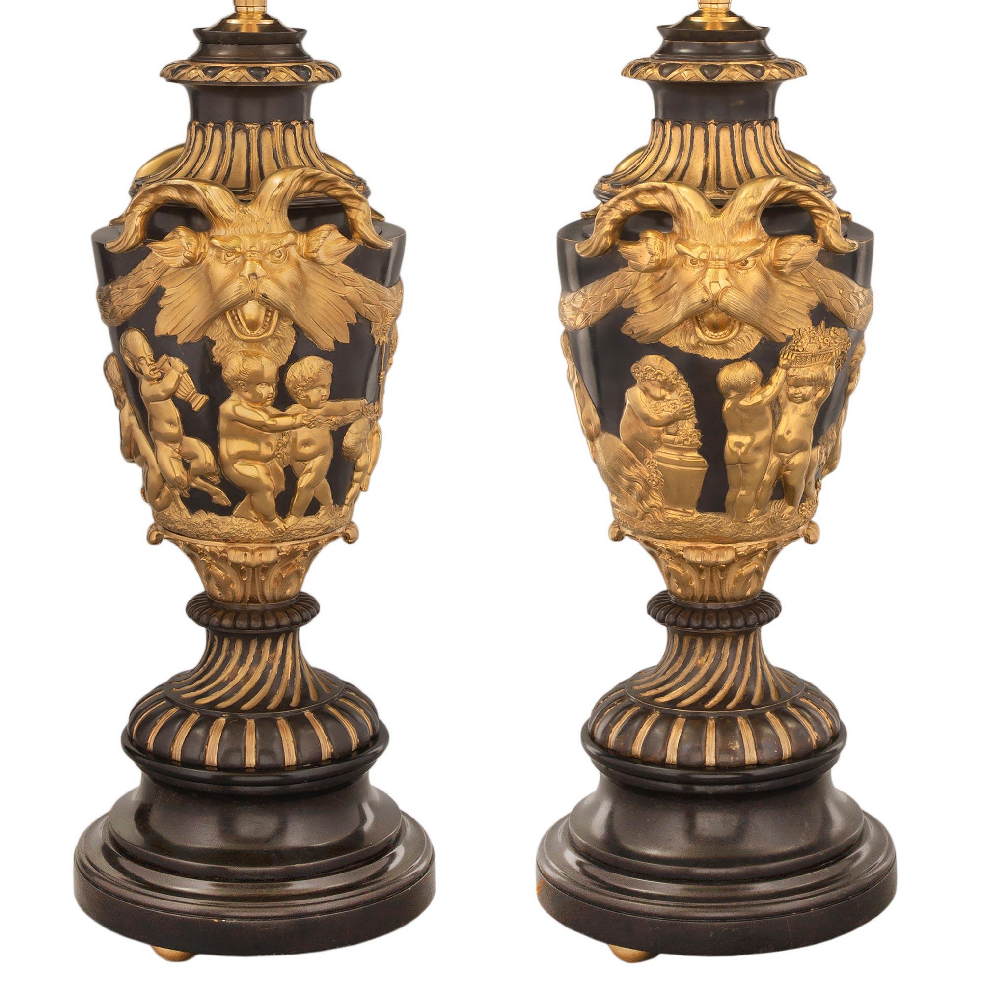 Patinated Pair of French 19th Century Neoclassical Lamps in the Manner of Clodion For Sale