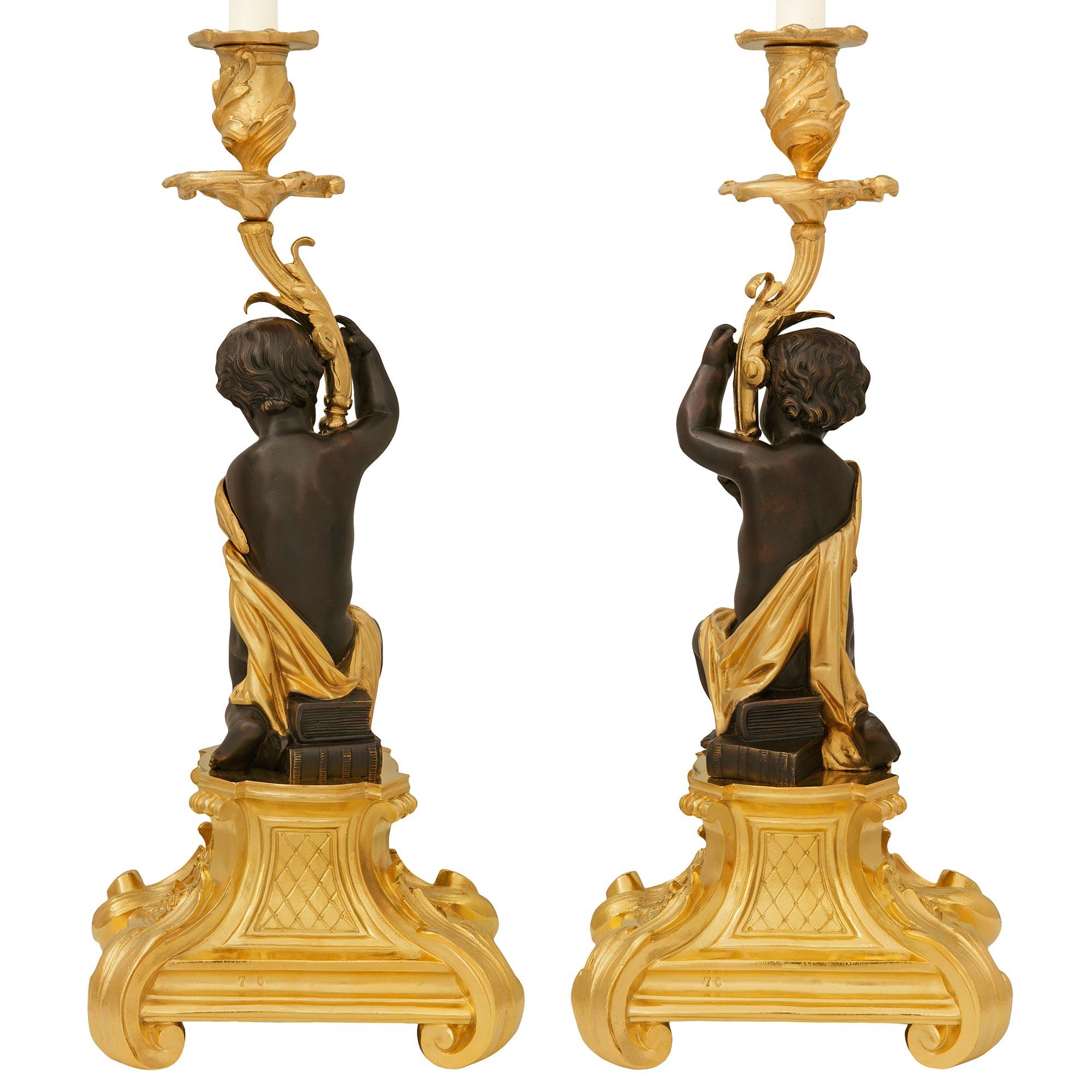 Belle Époque pair of French 19th century Ormolu and Bronze candlesticks, by Picard For Sale