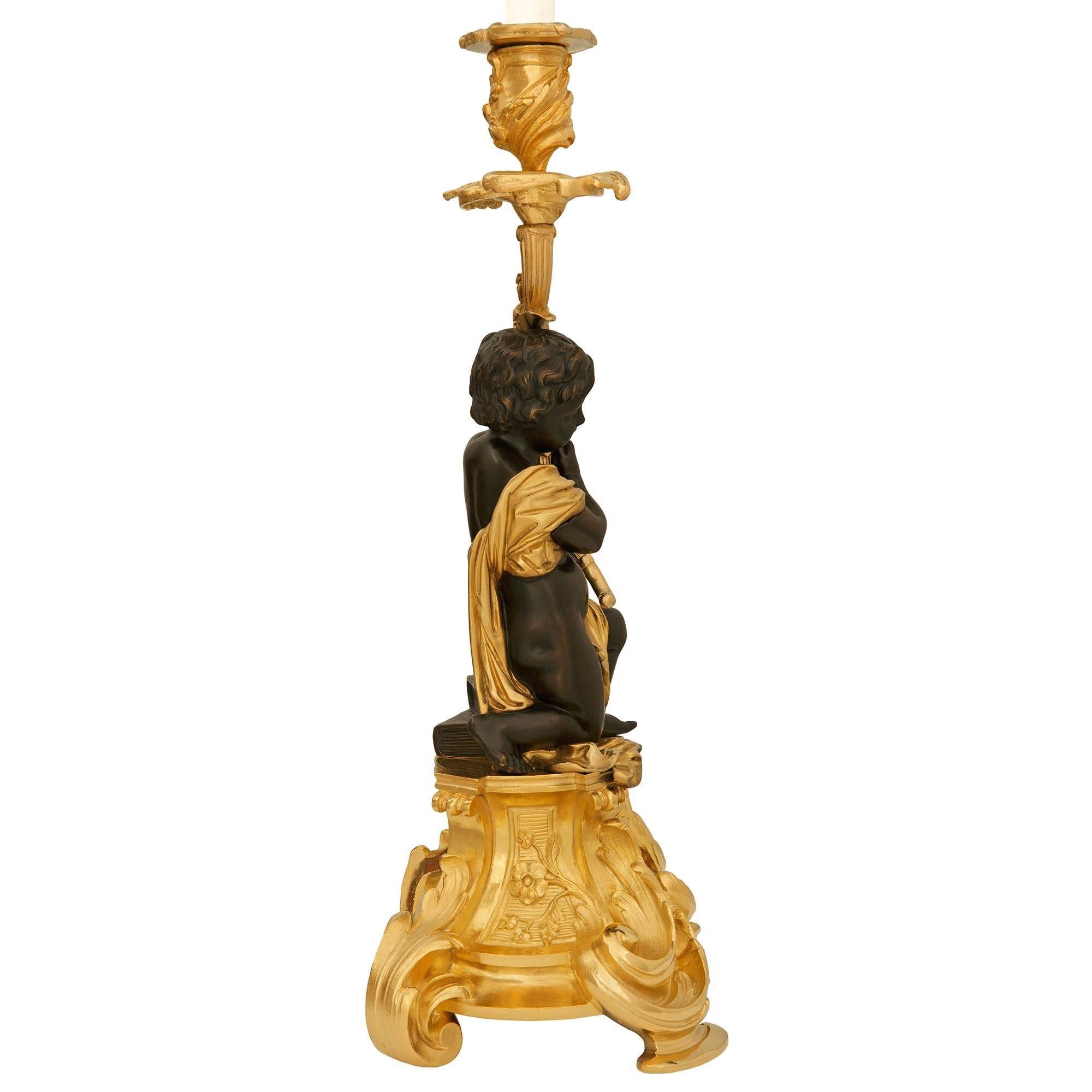 19th Century pair of French 19th century Ormolu and Bronze candlesticks, by Picard For Sale