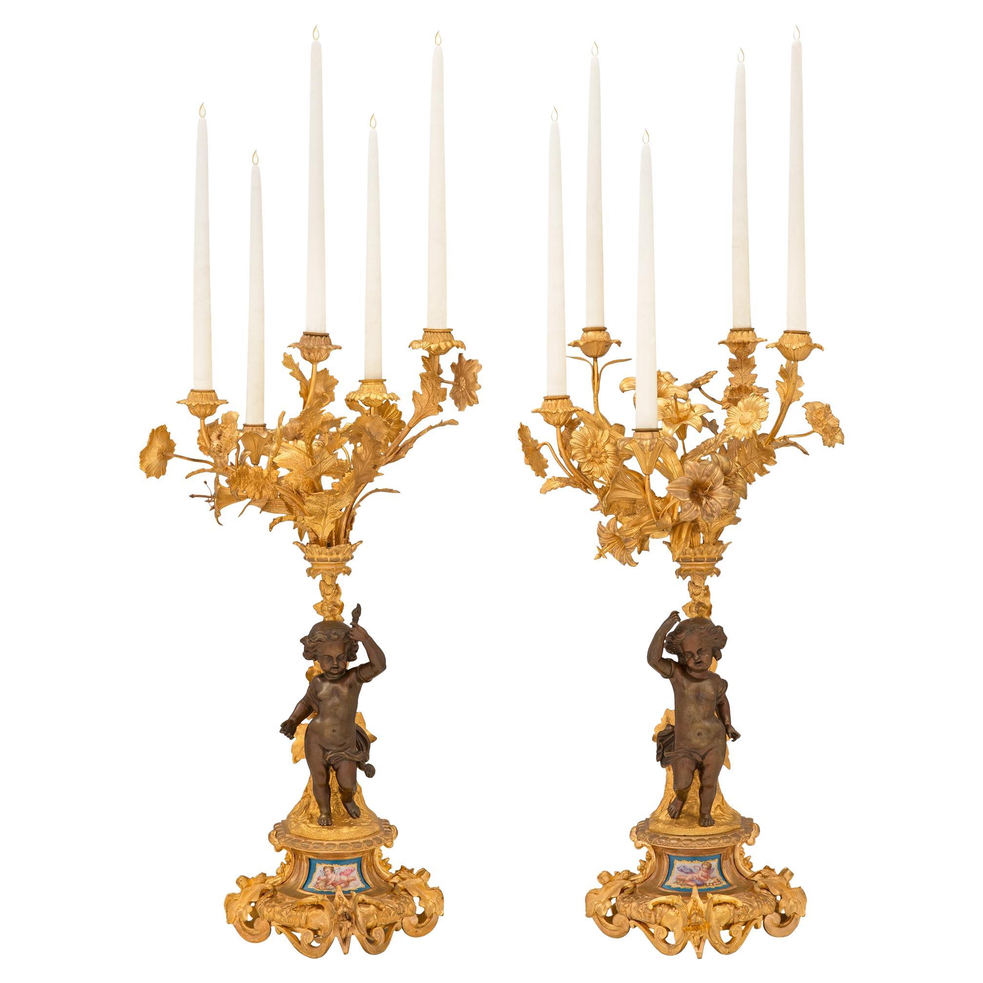 Pair of French 19th Century Ormolu and Patinated Bronze Candelabras