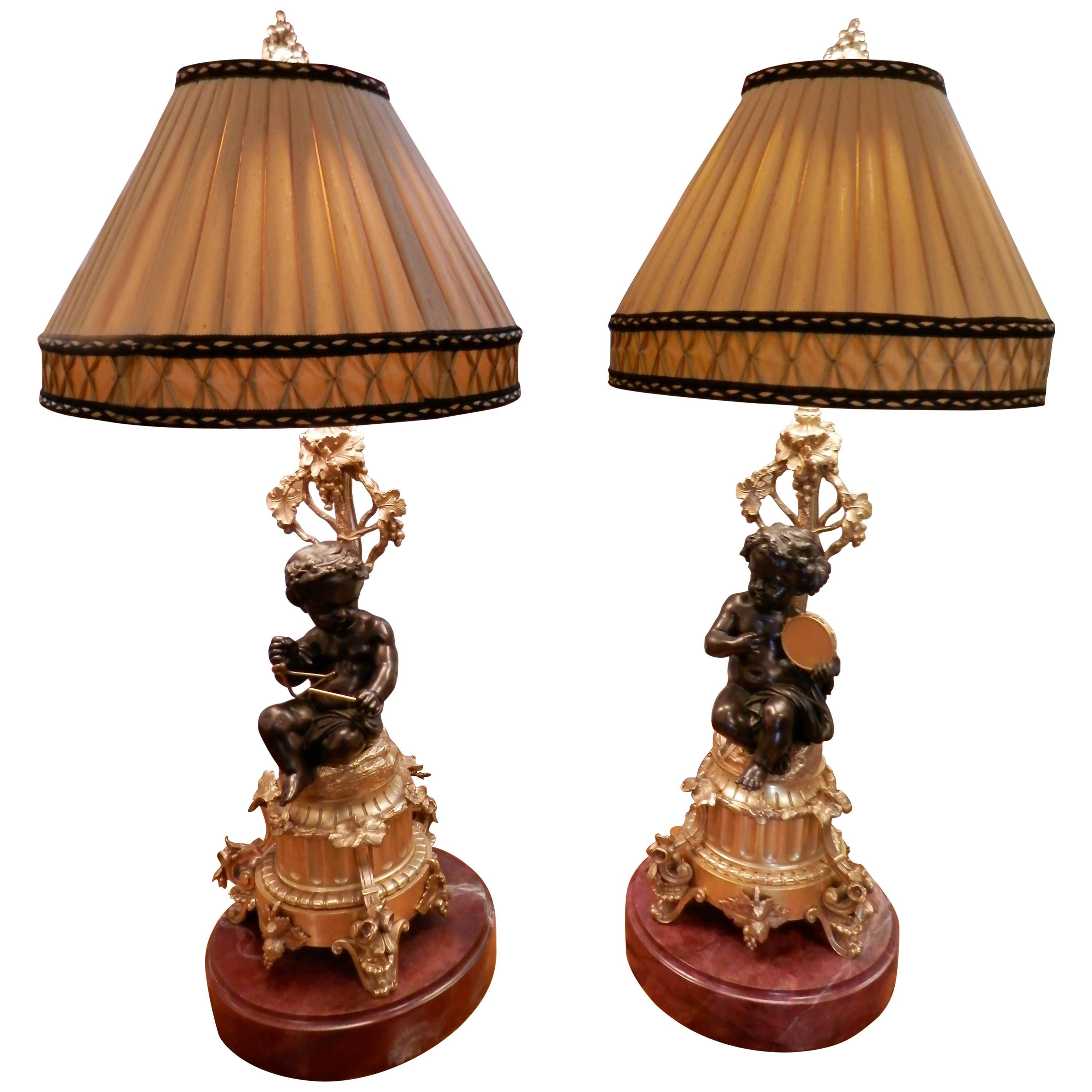 Pair of French 19th Century Patinated and Gilt Bronze Cherub Lamps
