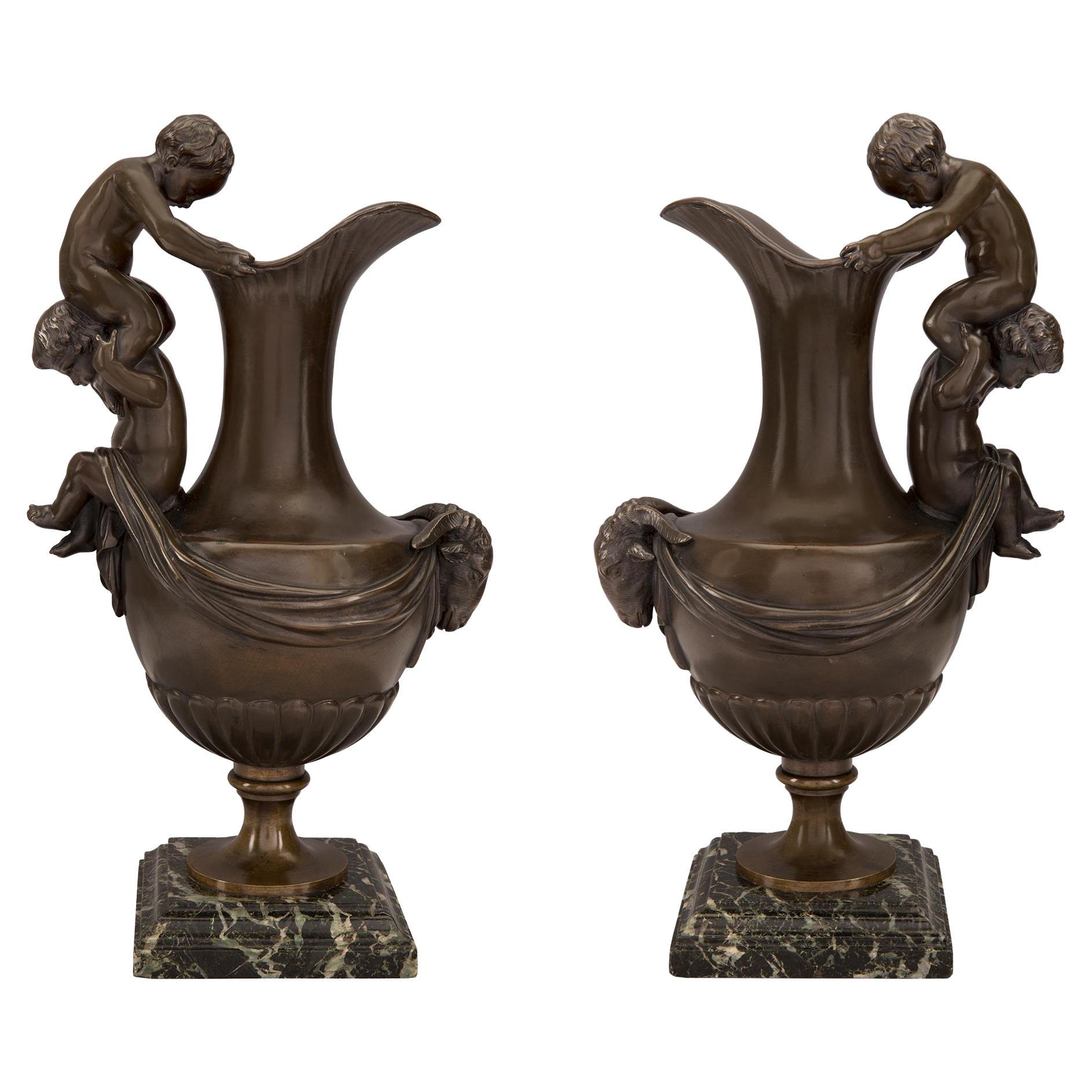 Pair of French 19th Century Patinated Bronze Ewers For Sale