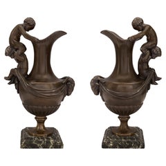 Pair of French 19th Century Patinated Bronze Ewers