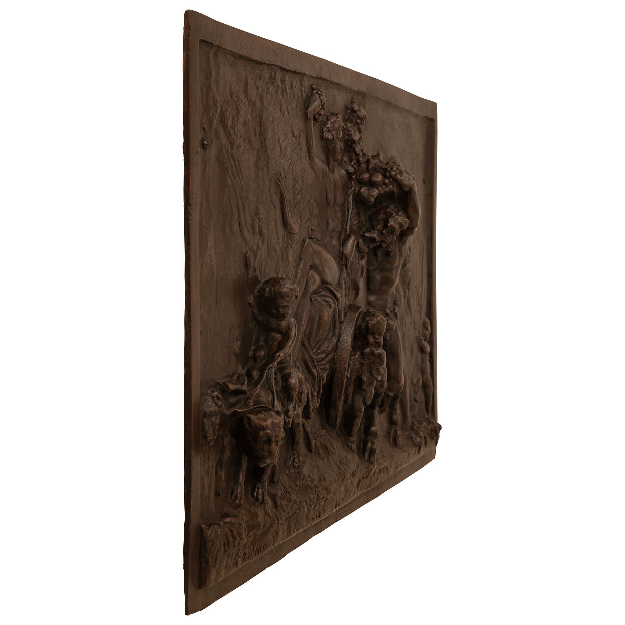 A wonderful and extremely decorative pair of French 19th century patinated Bronze plaques, after a model by Clodion. Each rectangular plaque depicts jovial scenes or cherubs playing with musical instruments, picking flowers, dancing and classical