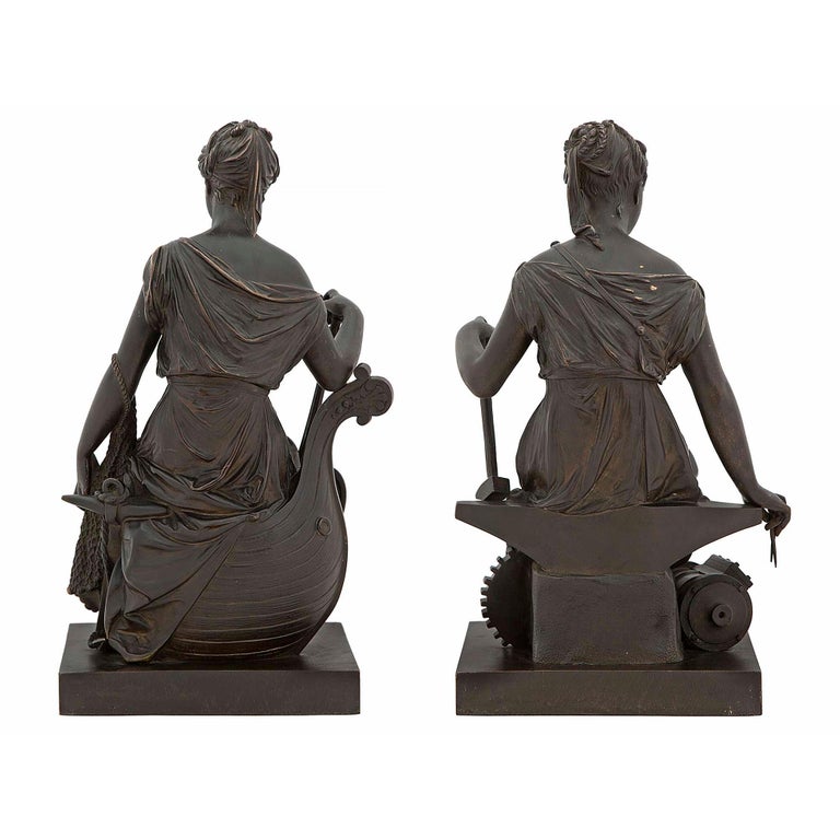 A wonderful and very detailed pair of French 19th century patinated bronze statues. Each is raised on a square base with the word 