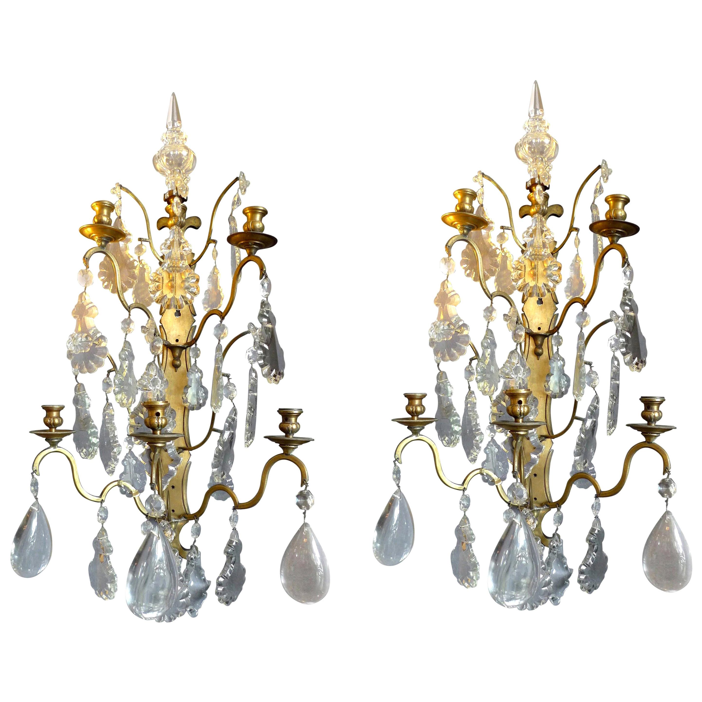 Pair of French 19th Century Polished Bronze and Crystal Sconces
