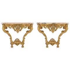 Pair of French 19th Century Regence St. Giltwood and Marble Consoles