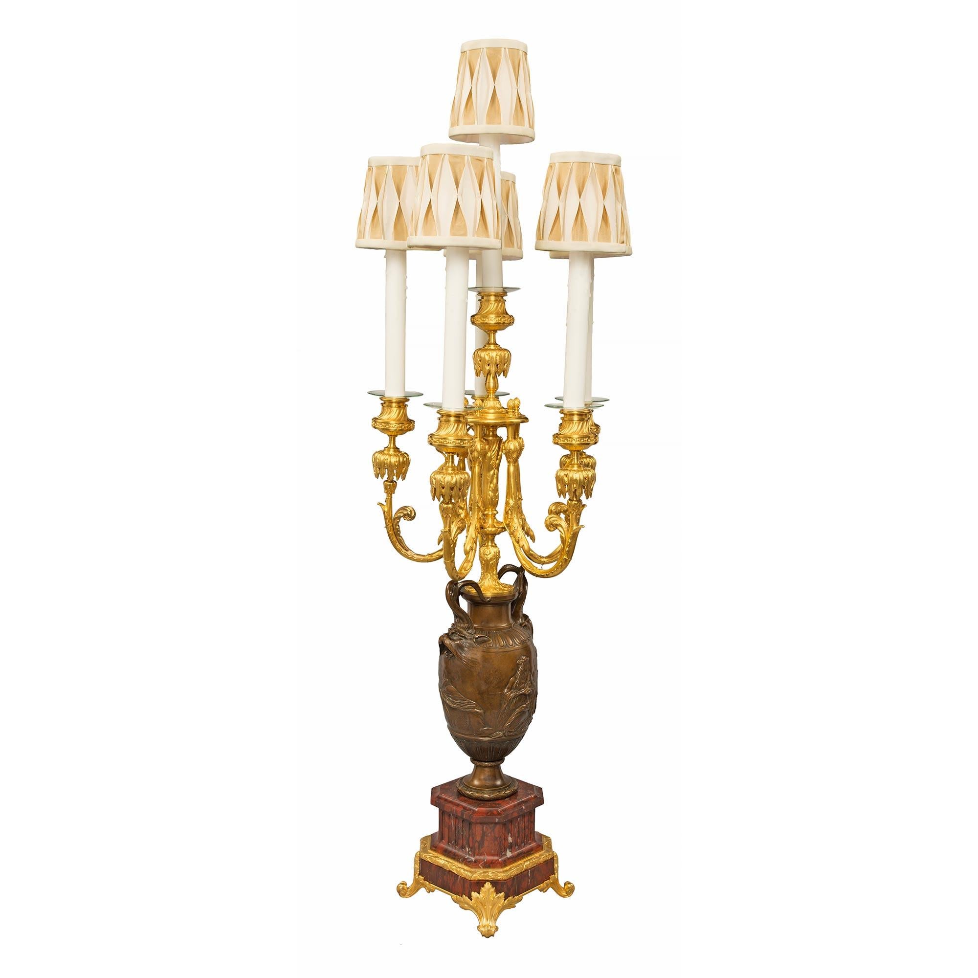 A stunning pair of French 19th century Renaissance st. patinated bronze, ormolu and Rouge Griotte marble candelabra lamps, signed Barbedienne. Each lamp is raised by a beautiful octagonal shaped Rouge Griotte marble base with a lovely fluted design,