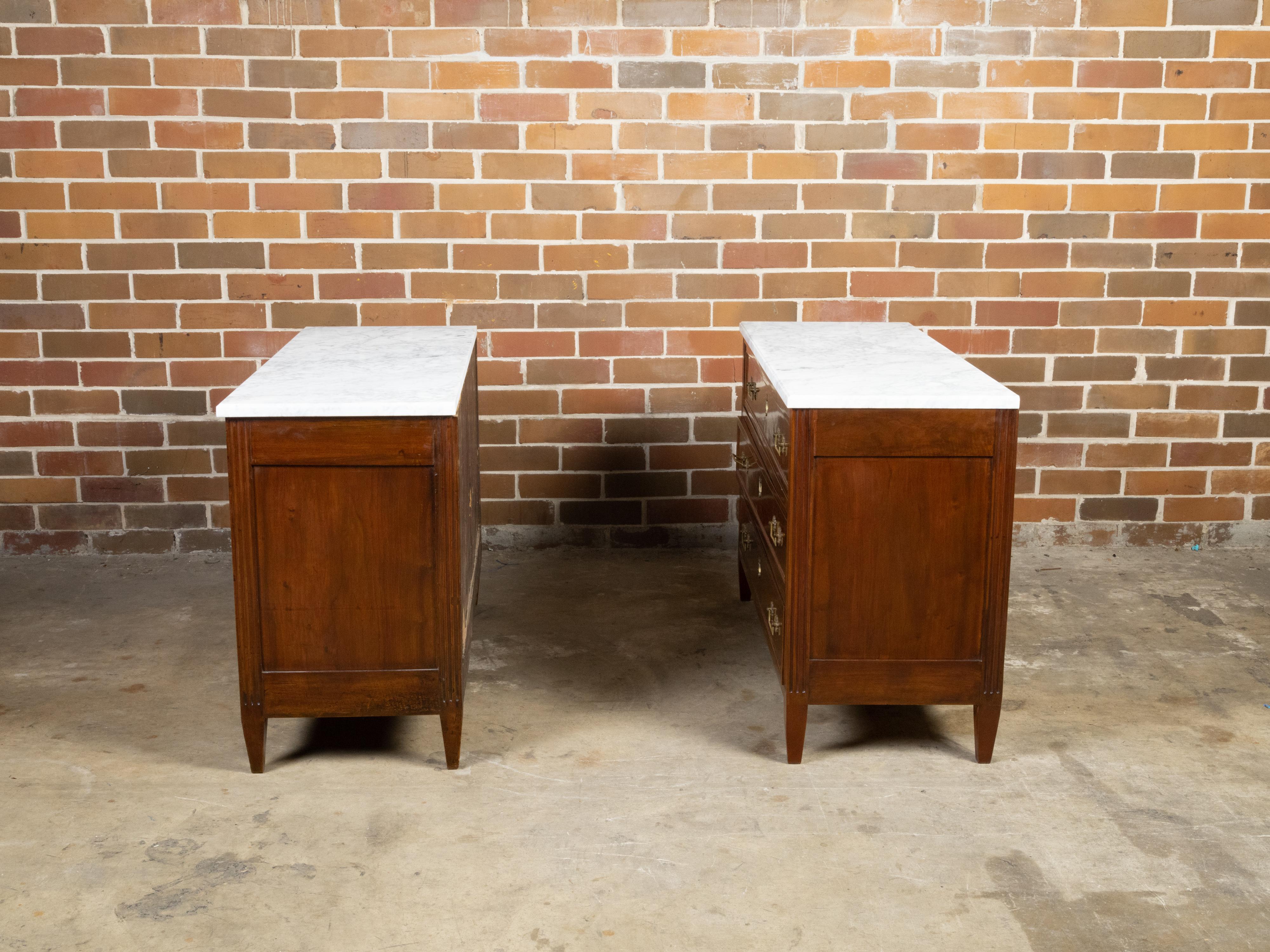 Brass Pair of French 19th Century Three-Drawer Walnut Commodes with White Marble Tops For Sale