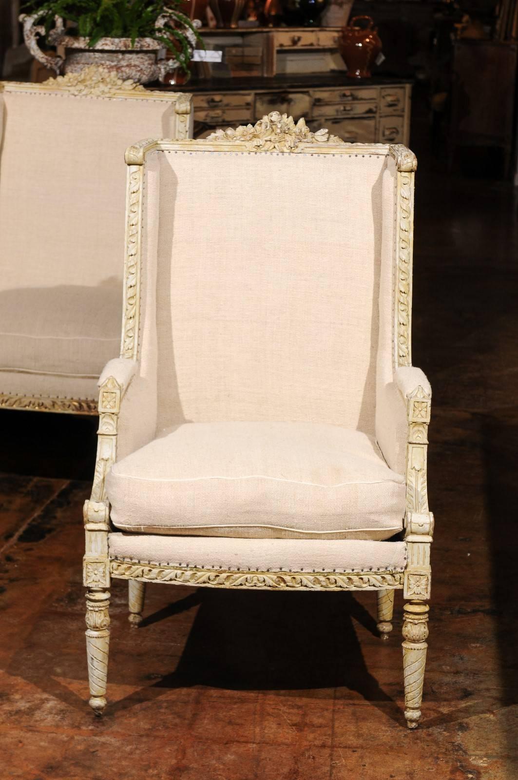 Pair of French 19th Century Wingback Bergères Chairs with Richly Carved Décor In Good Condition In Atlanta, GA