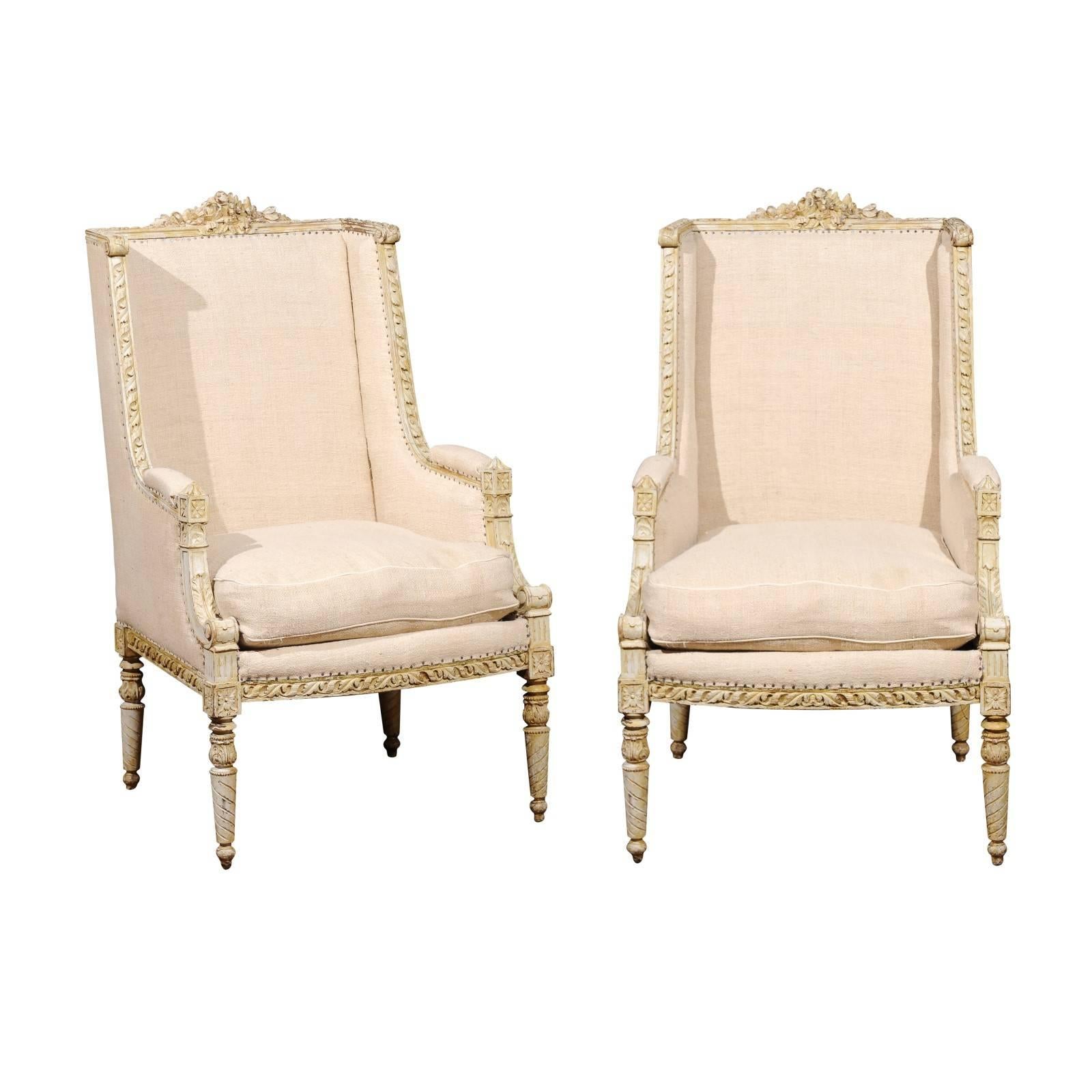 Pair of French 19th Century Wingback Bergères Chairs with Richly Carved Décor