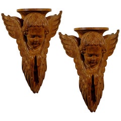 Pair of French 19th Century Wooden Wall Brackets with Carved Cherubs