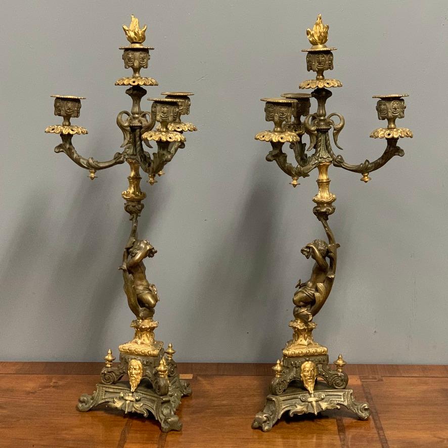 Super quality pair of 19th century French gilt bronze candelabra with three branches and centre holder with their original flaming candle snuffers.
Lovely coloring to this pair which have been lightly cleaned and buffed, but not overly so they do