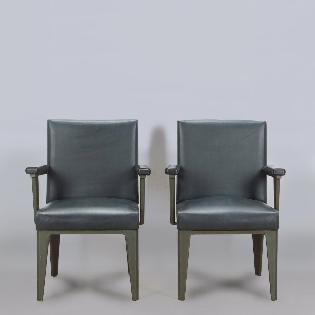 A stylish pair of French 1950s 'Clemenceau' chairs. 

Designed by Andre Domin and Marcel Genevriere for Maison Dominique. Still with their original dark green upholstery and painted metal frames. 

Minor bumps and scrapes commensurate with age.