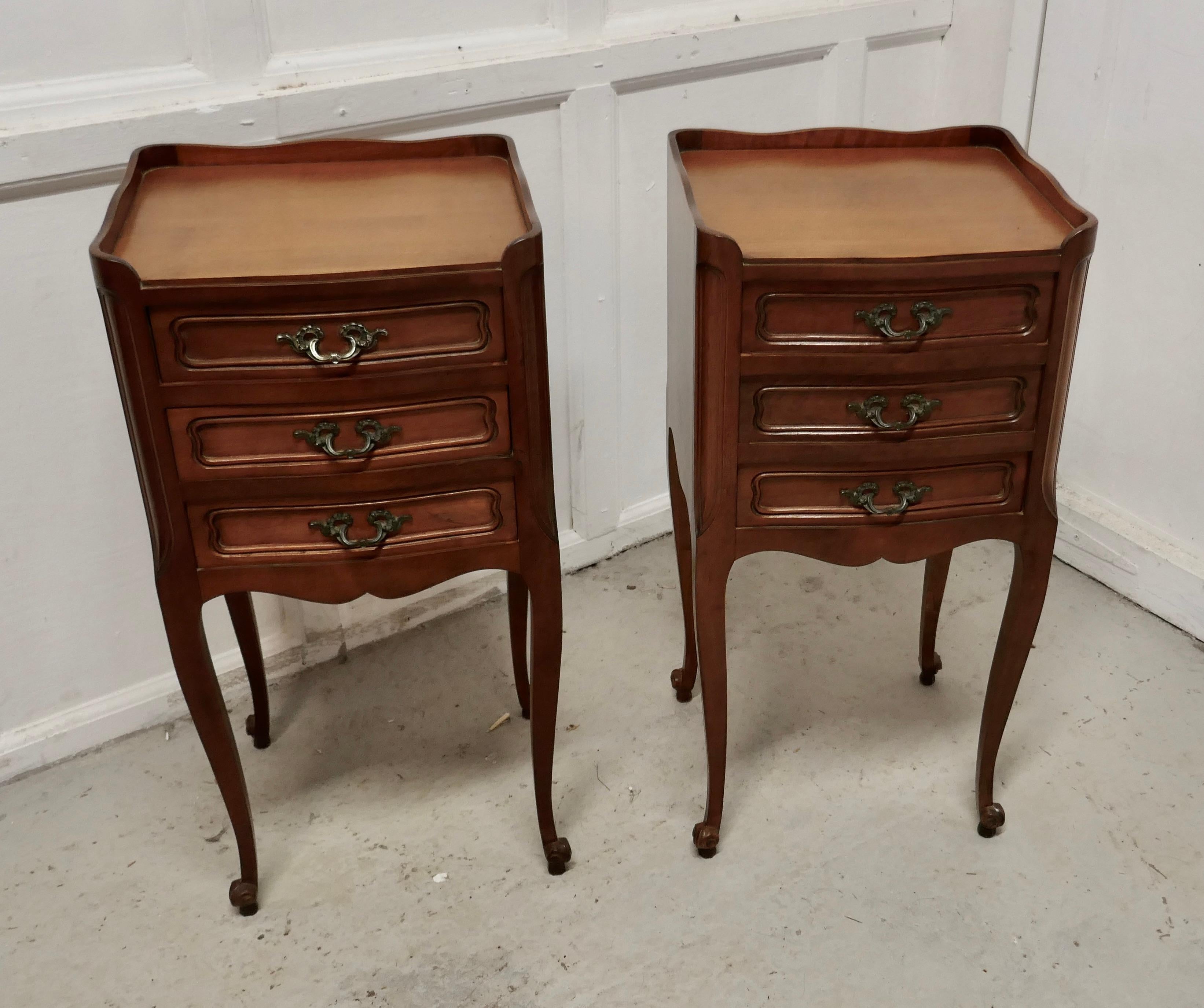 Pair of French. 3-drawer cherrywood bedside cabinets

This is a pretty pair of cabinets or chevets, they have a small gallery around the top, small and they stand on cabriole legs
Each cabinet has a 3 drawers and ormolu handles
The cabinets are