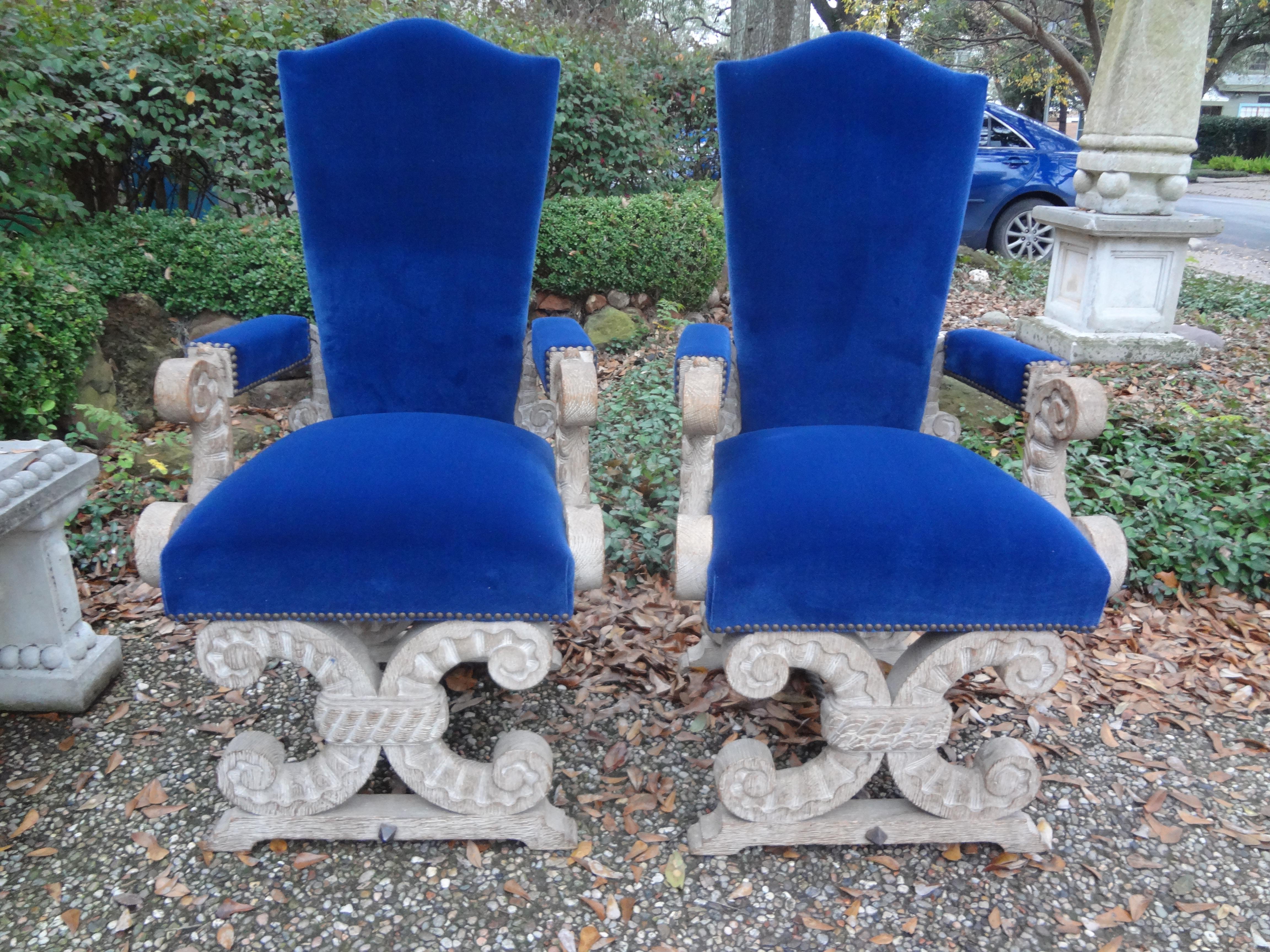 Stunning pair of French cerused oak chairs attributed to Francisque Chaleyssin. This versatile pair of French high back limed oak armchairs or side chairs can be used in an entrance hall, dining chairs or as side chairs as needed. This beautiful