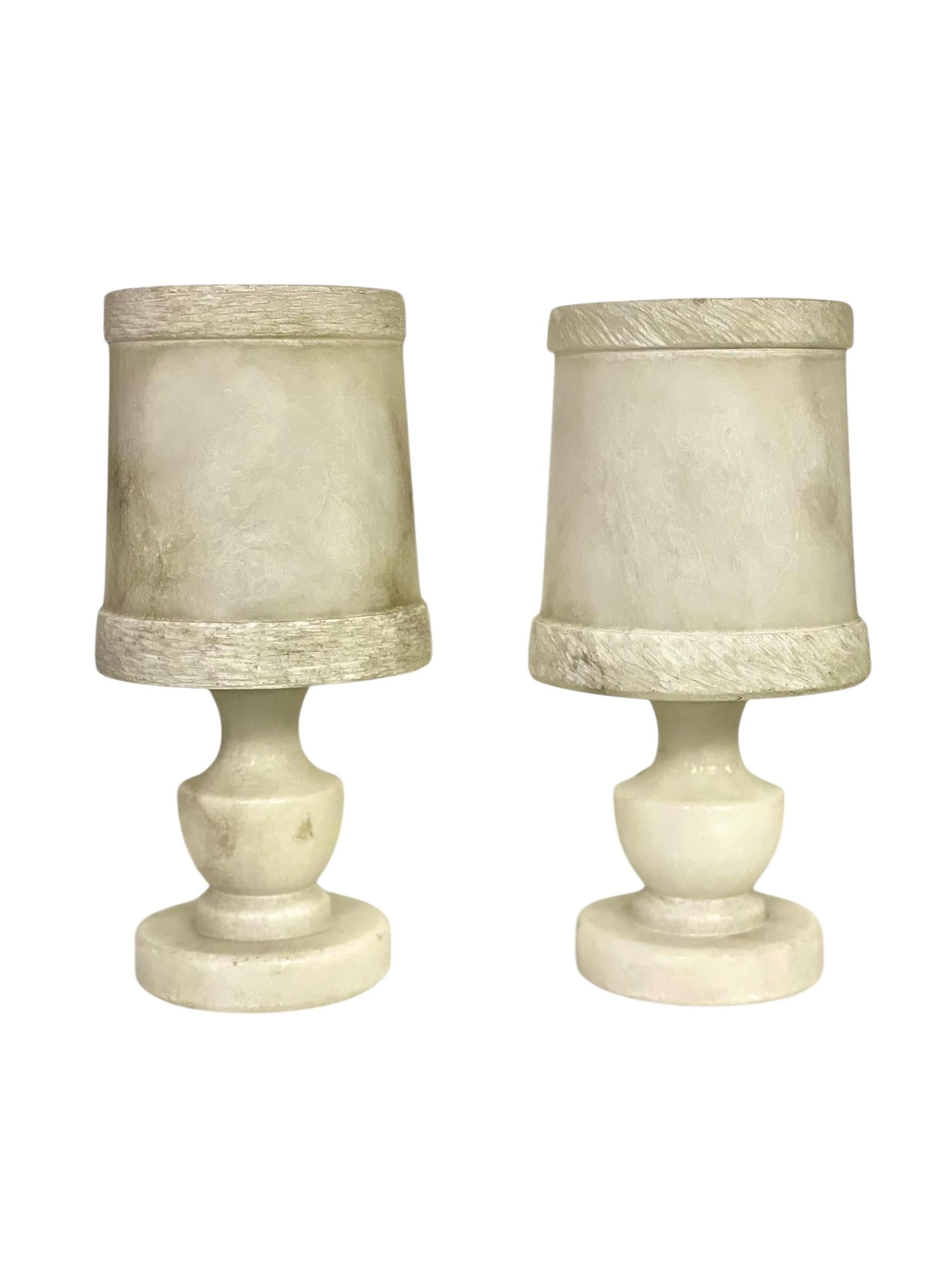 A refined pair of alabaster table lamps, handcrafted in France around 1890. These elegant pieces exemplify the decorative taste of the late 19th century, when natural materials and classical forms were highly sought after in refined