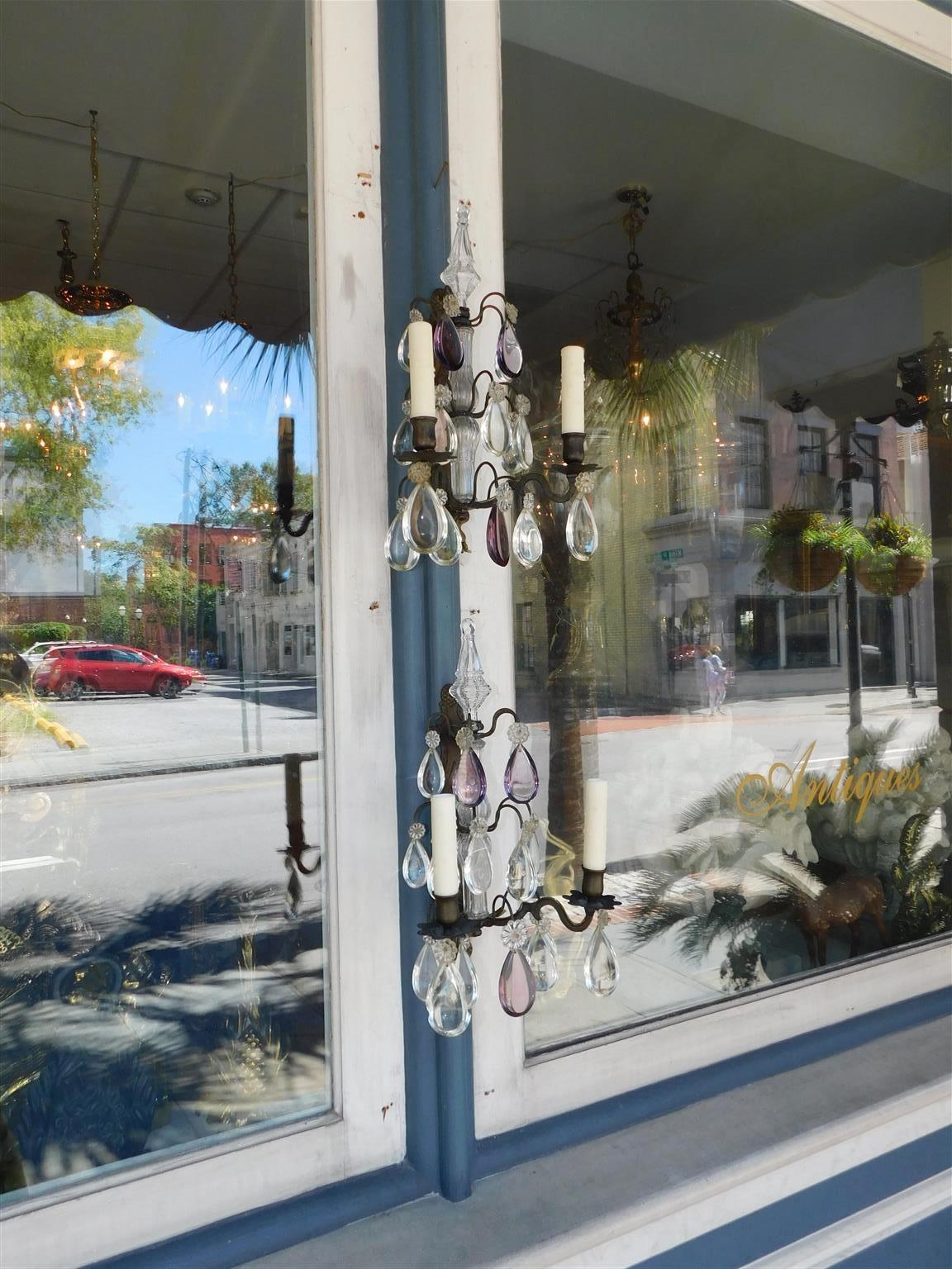 Pair of French Amethyst crystal and bronze two arm sphere finial wall sconces. Pair were originally candle and have been electrified. Early 19th Century.