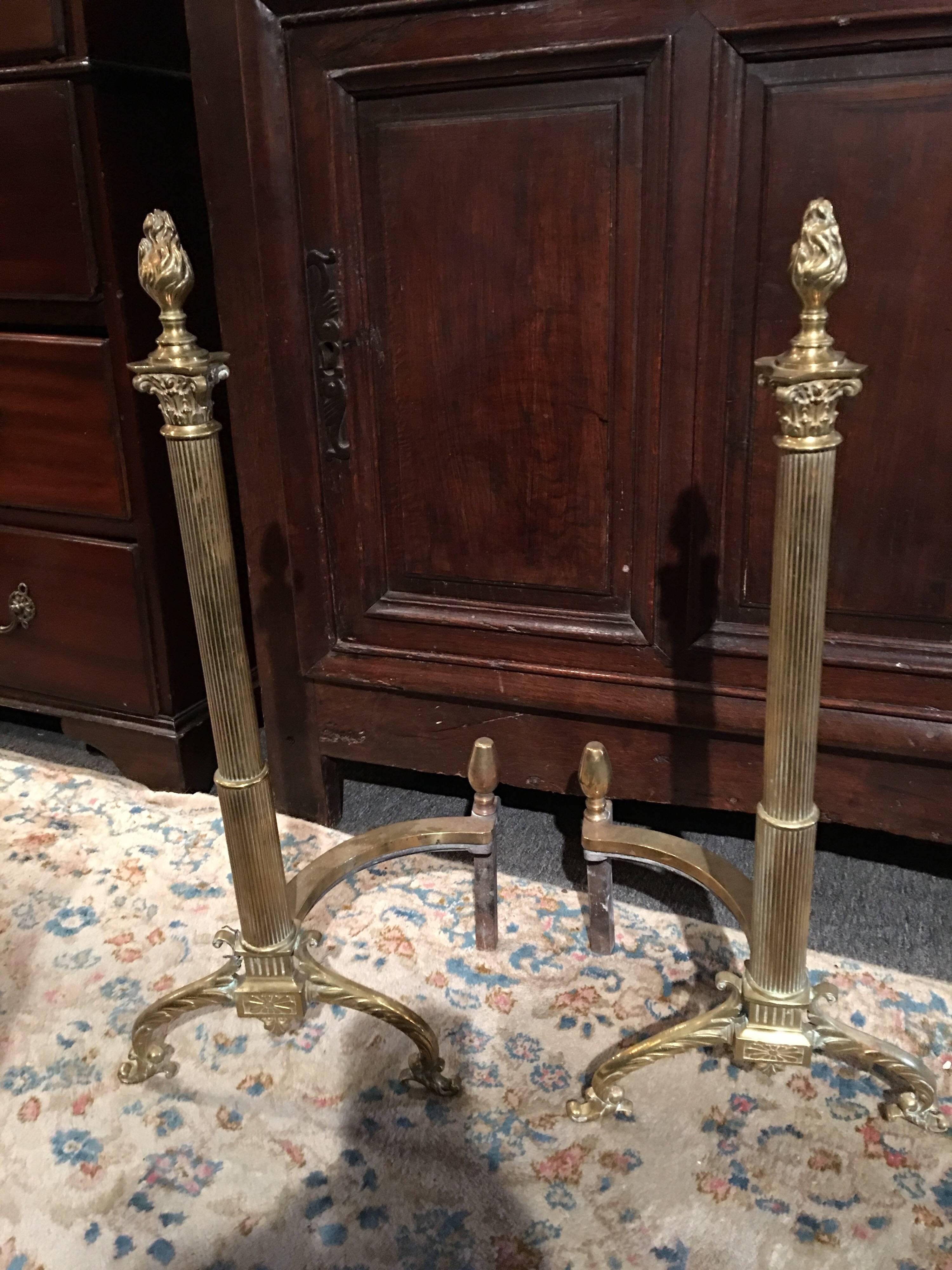 Pair of French andirons or chenets with flame finial design, 19th century.