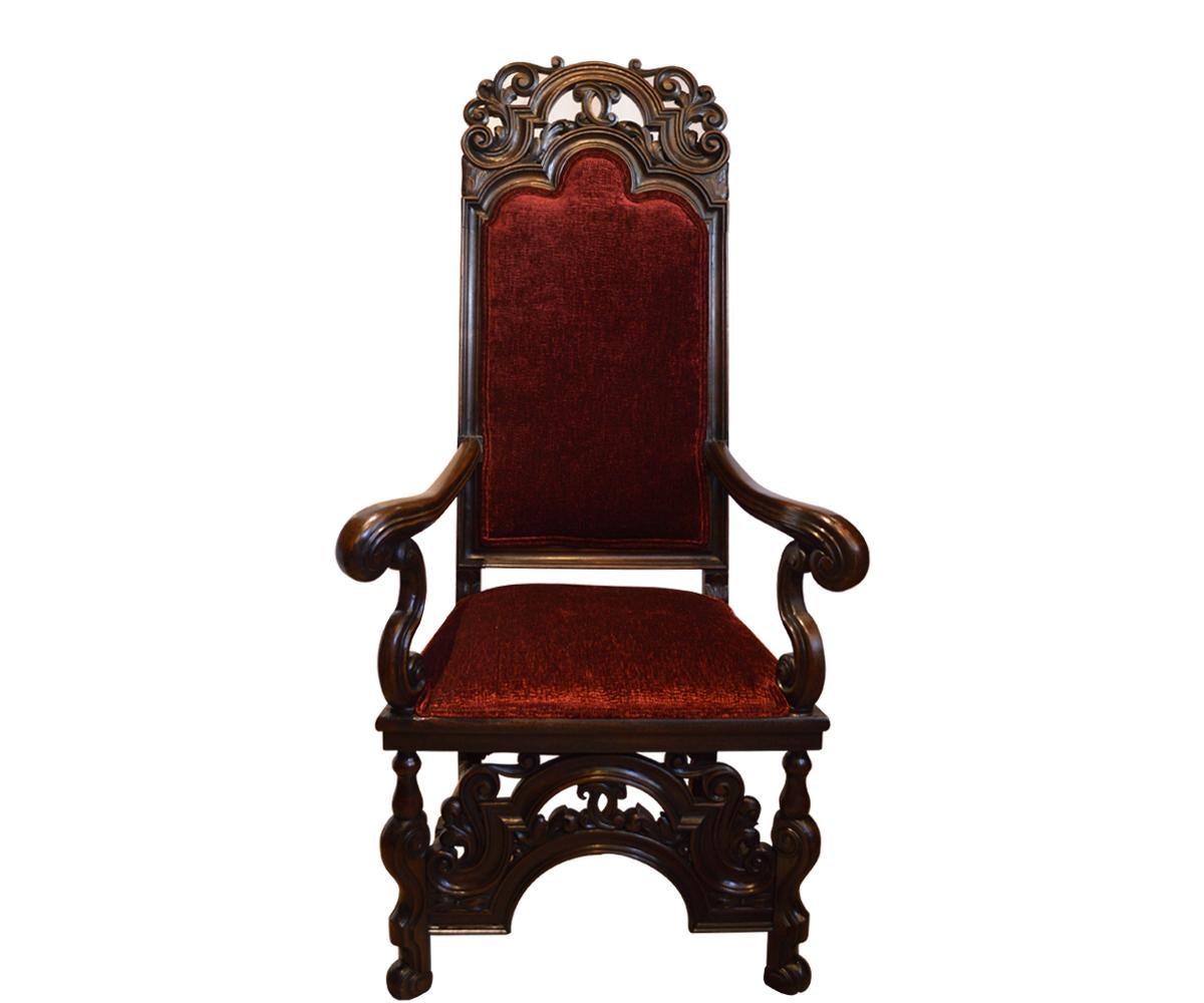 These chairs have been fully refurbished by our in house craftsmen thus they are very sturdy and comfortable. They have been recovered with a luxurious, deep burgundy chenille fabric. The hand-carved walnut is very extensive on these chairs