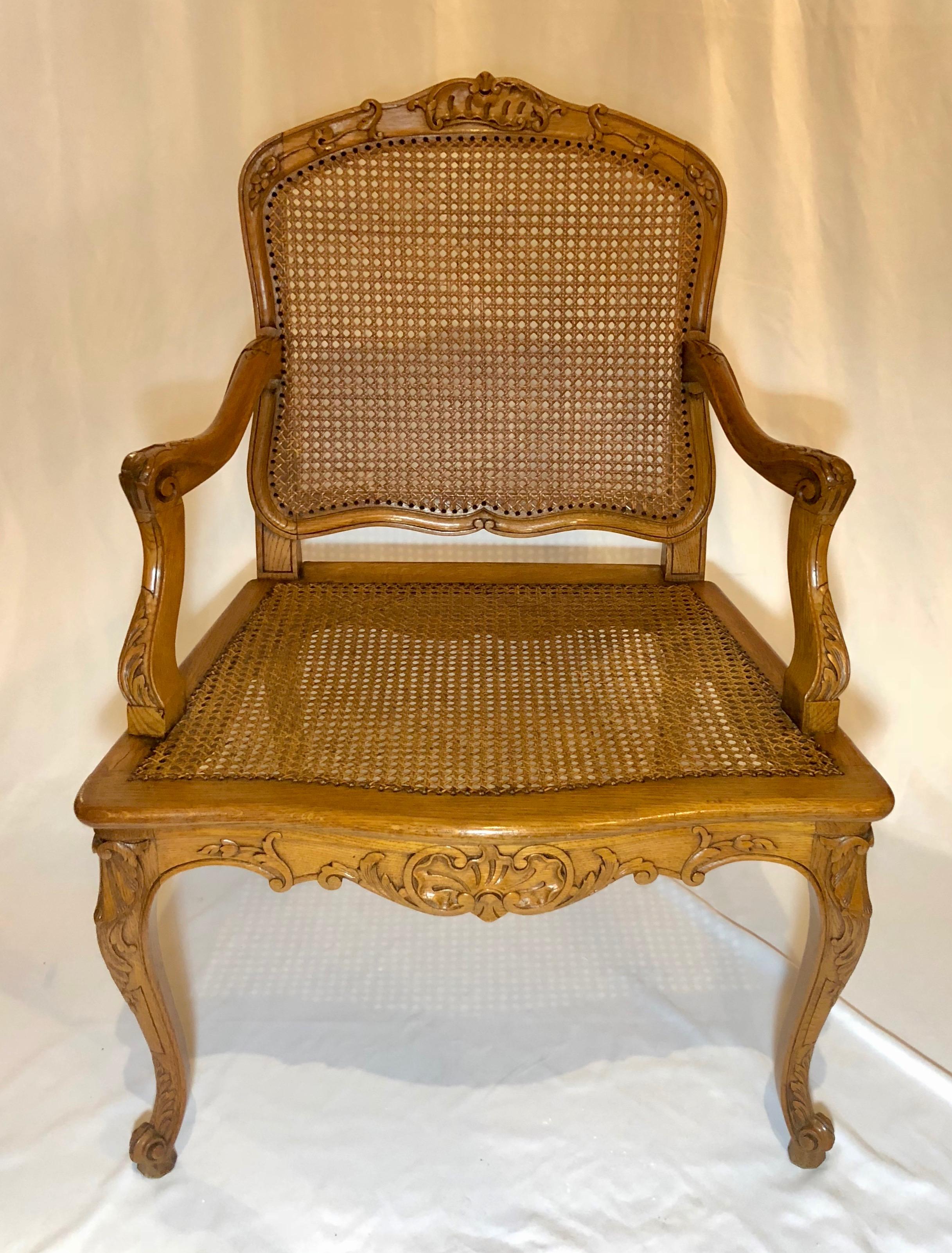 Pair of French antique carved elm armchairs, circa 1910-1920.