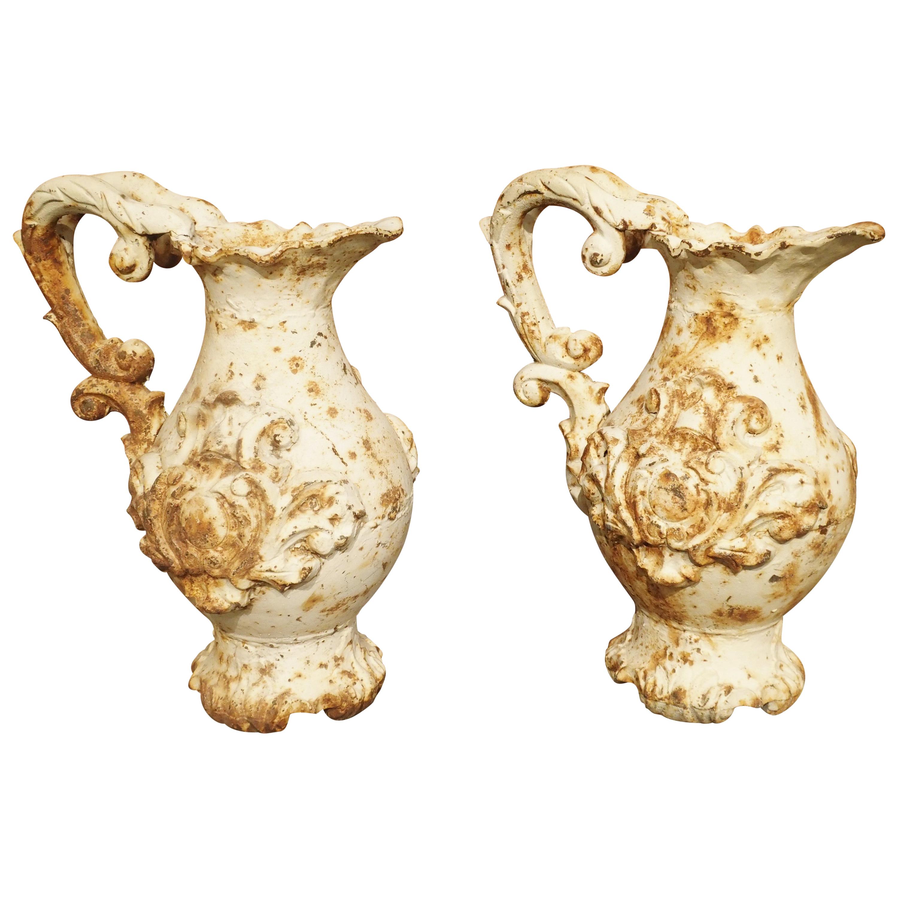Pair of French Antique Cast Iron Pitchers