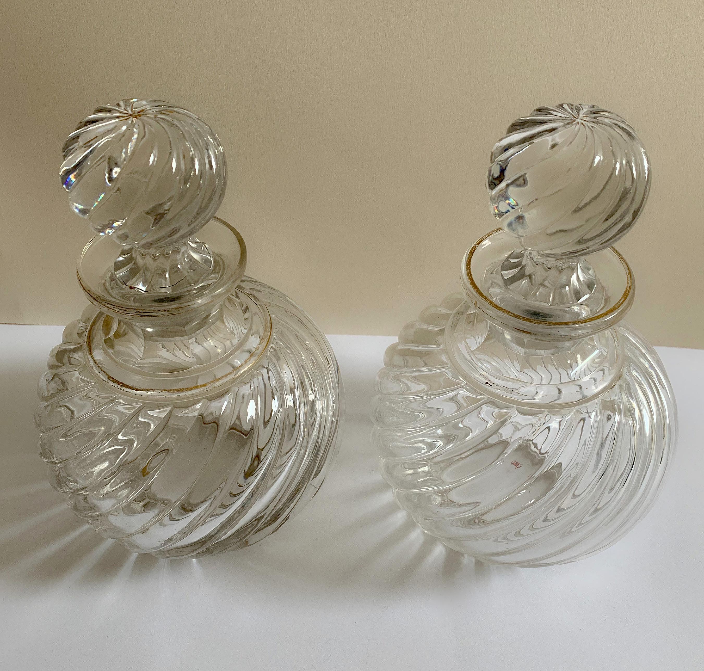 Pair of French antique Baccarat bottles in a swirled bamboo pattern.
Original lid.
Measures: Height 19.50 cm
Circumference: 40.00 cm.