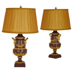 Paire de lampes françaises anciennes en bronze doré et porphyre 