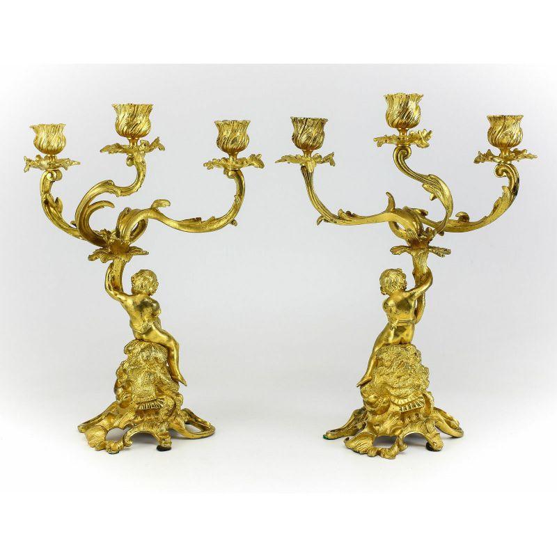 Pair of French Antique gilt bronze angels or putti candelabra chandeliers 19th century

Pair of Putti French Gilt Bronze candlesticks, late 19th or early 20th century. beautiful raised partially clad Putti Figure entangled in a nest of leafy