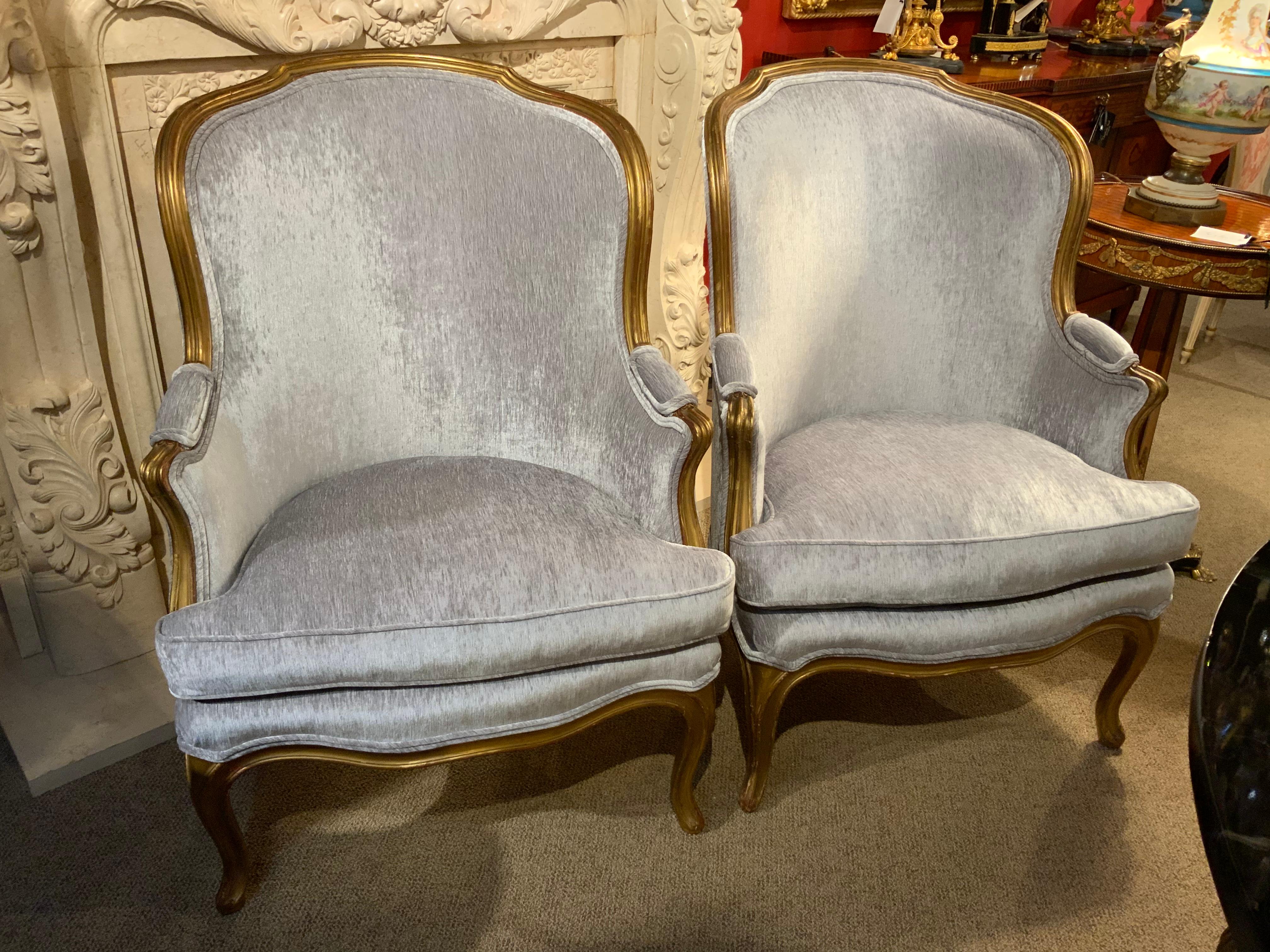 The curved back design of these chairs make them desirable 
Because they are not only a beautiful design but they are
Comfortable. The giltwood is in antique gilt finish with a light
Red hue under glow. They have been re-upholstered in a