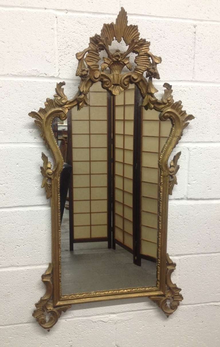 Pair of Late 19th Century French antique hand carved wooden gilded mirrors.
 