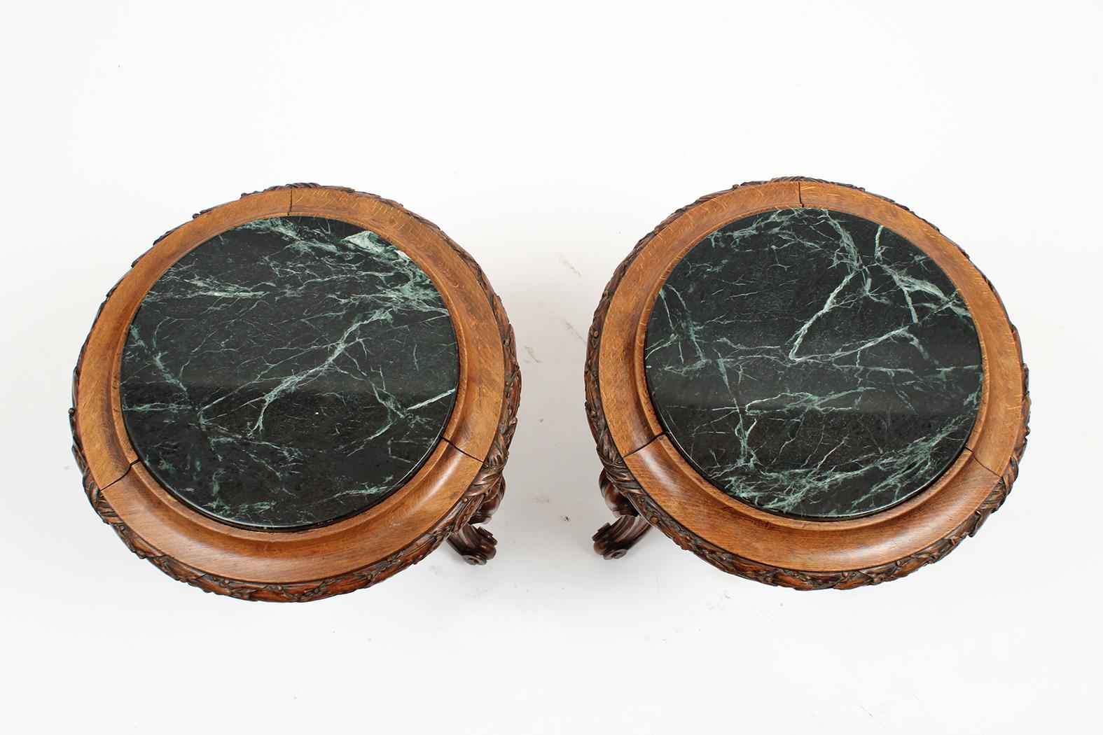 This beautiful pair of 19th century Louis XVI style garden stools are made out of solid walnut wood and features an intricately carved molding along the top and legs. Each leg has a carved seashell and scroll design. The pair also comes with the