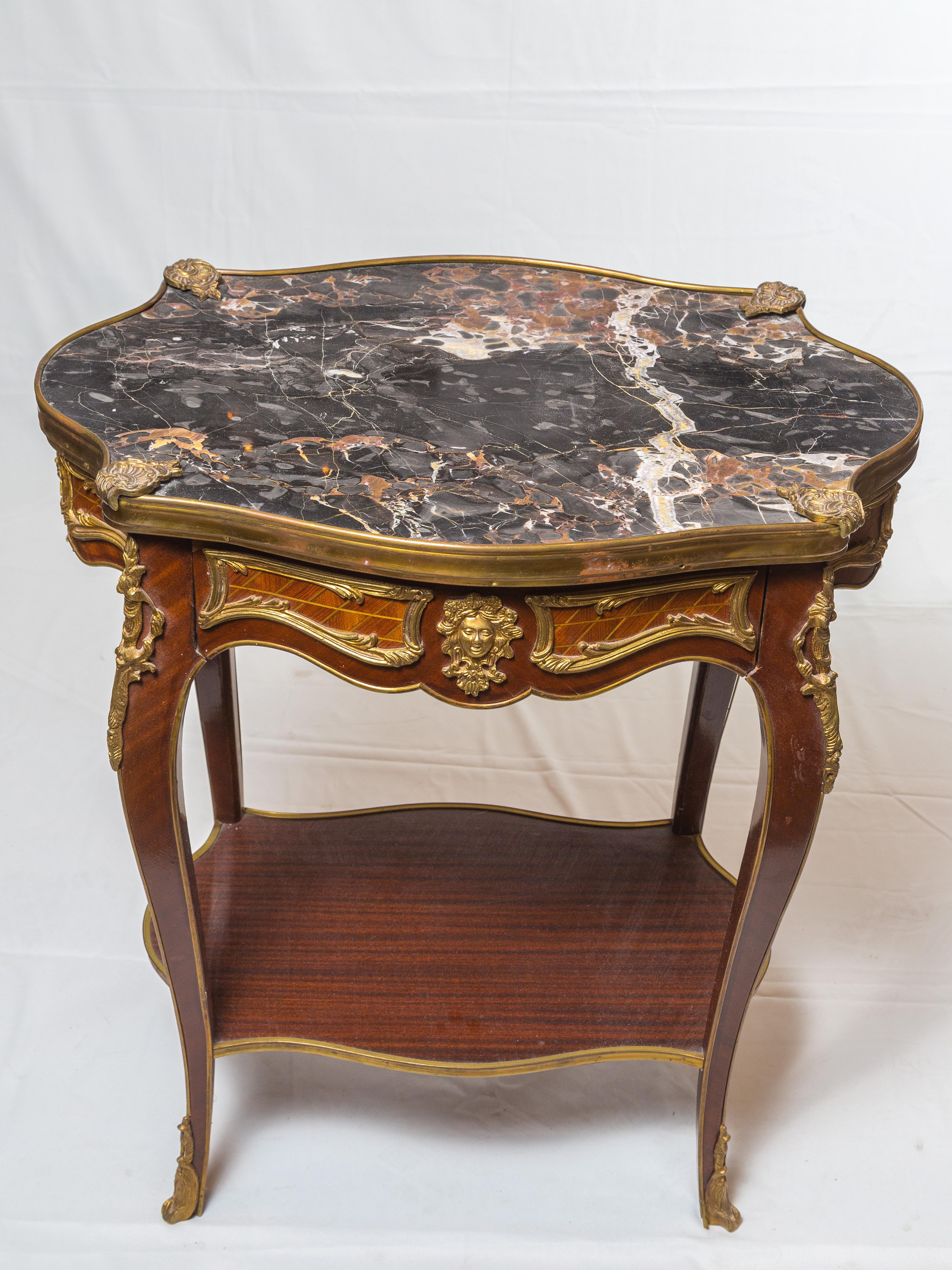 Pair of Louis XV style nightstands with
black marble top. In excellent conditions.