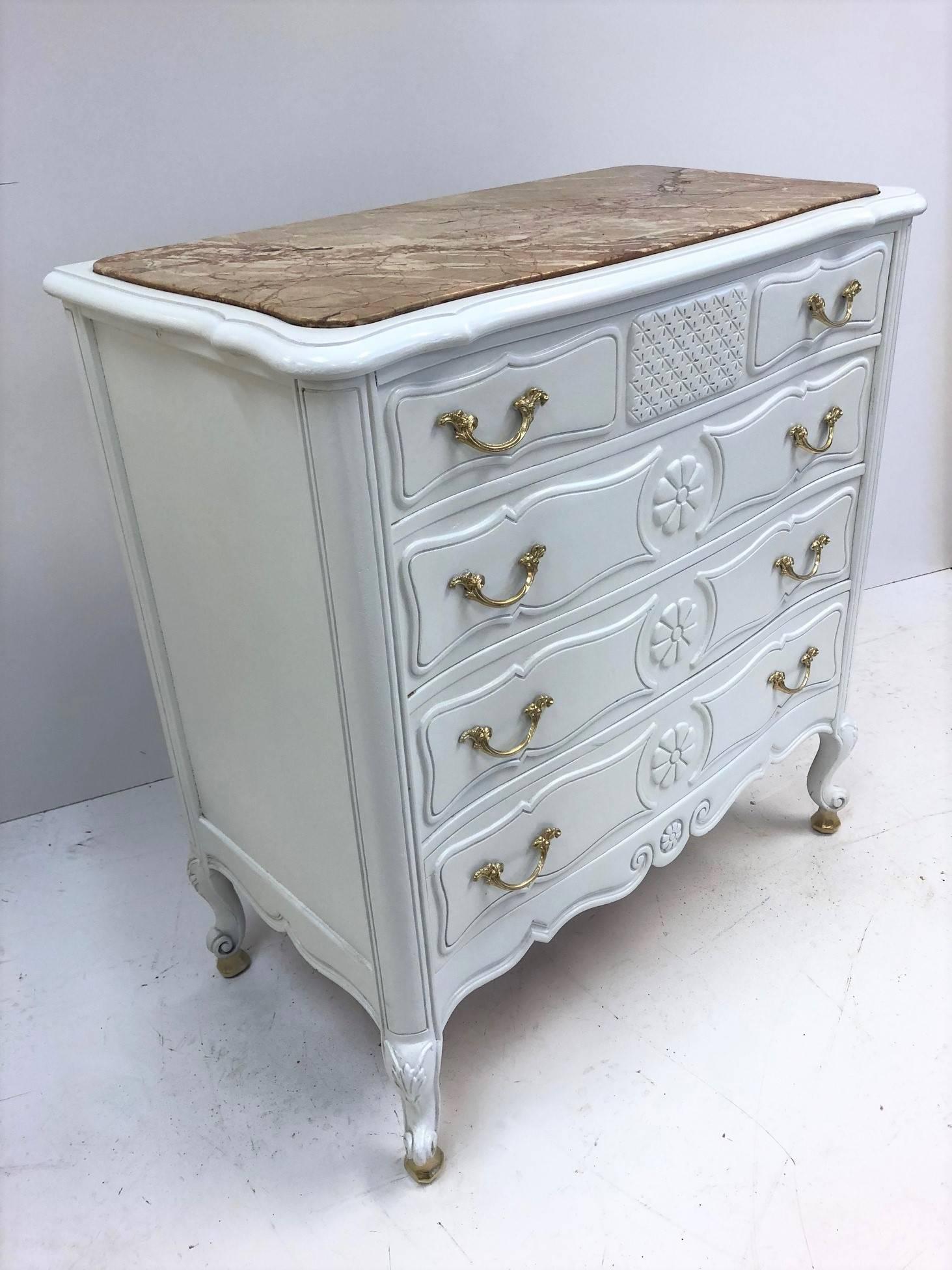 Pair of French antique style marble-top chests with a white painted finish. Each chest have four pull out drawers, marble tops with gold handles and feet.
