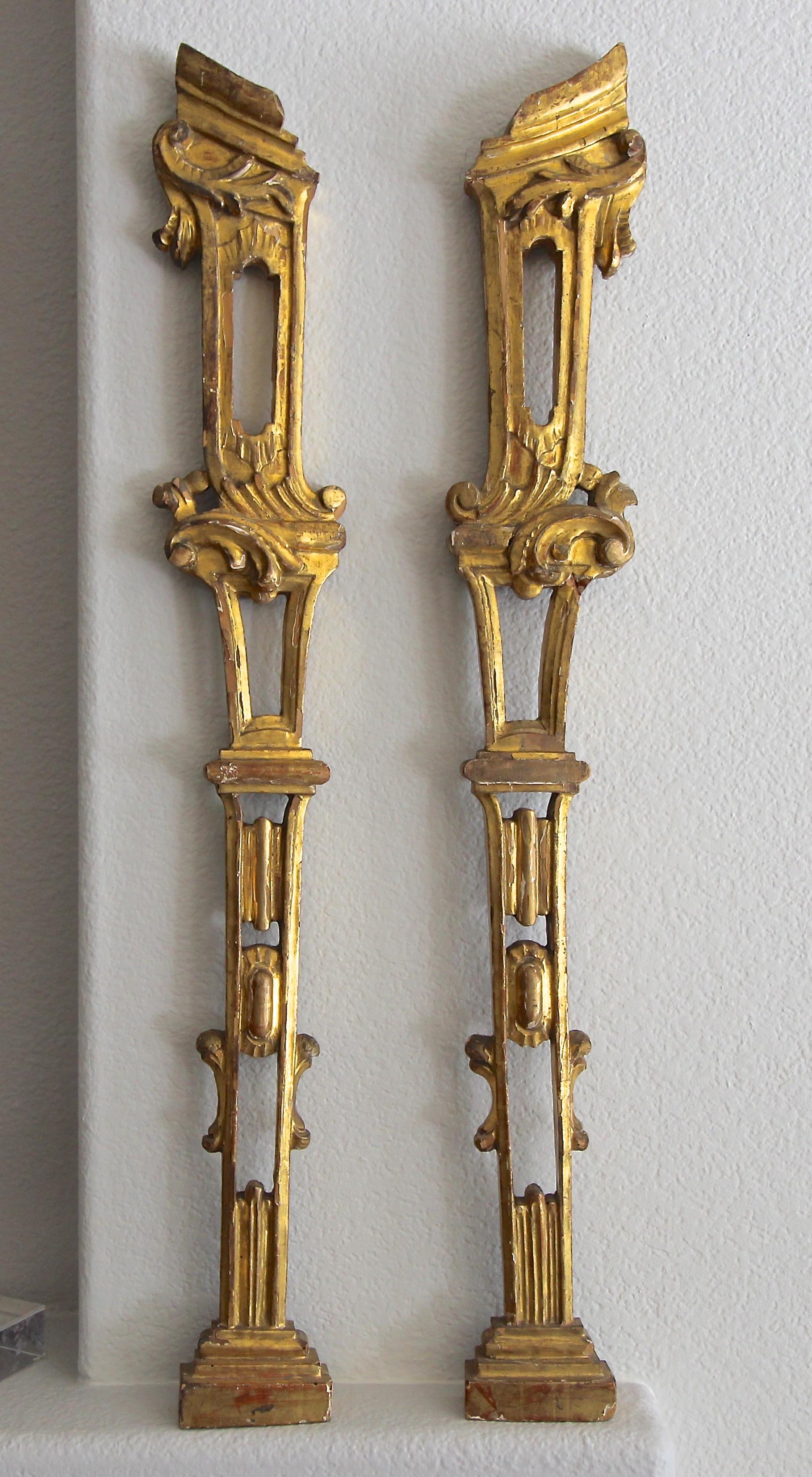 Pair of tall 19th century French architectural carved giltwood fragments wall art. Great accent pieces for modern and traditional decor settings.
 