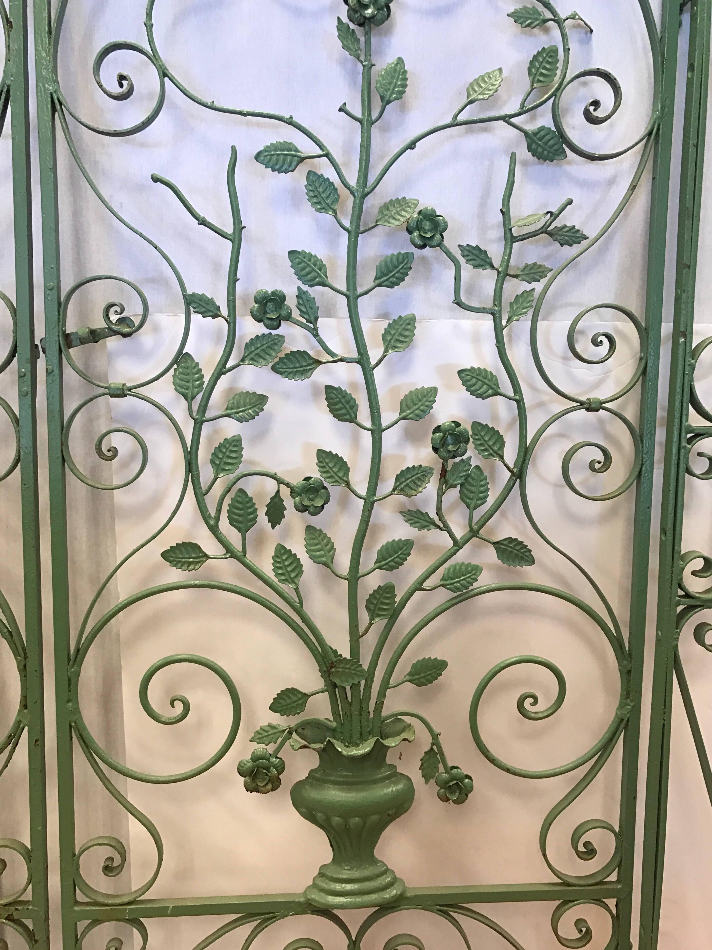 France, this matching pair of painted wrought iron gates work together and have center latch and ground support, circa 1880s. The metalwork is marvelous and one of a kind.