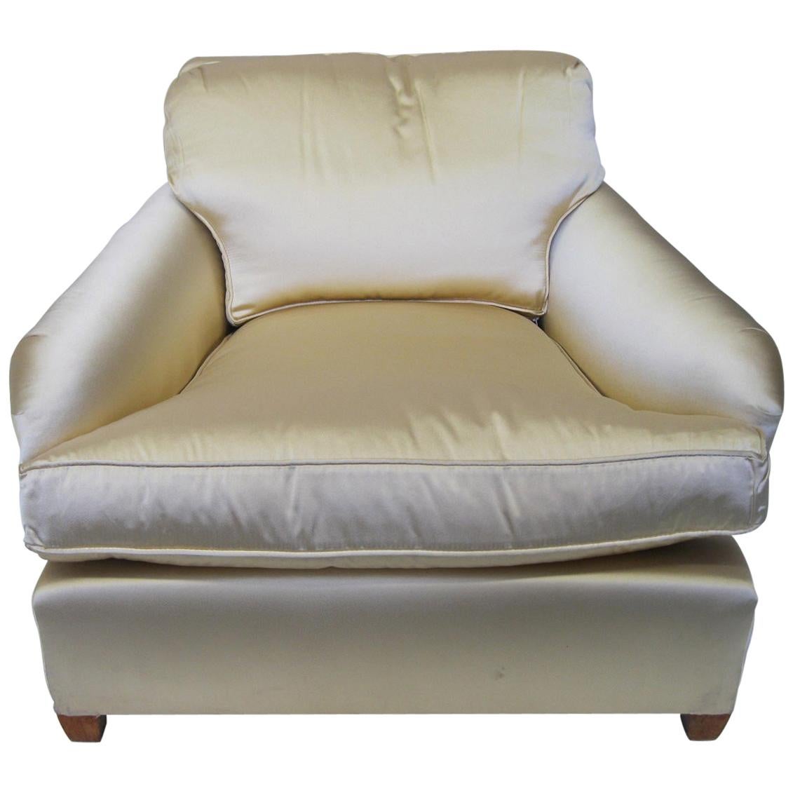 Two French armchairs upholstered in champagne colored satin.

Property from esteemed interior designer Juan Montoya. Juan Montoya is one of the most acclaimed and prolific interior designers in the world today. Juan Montoya was born and spent his