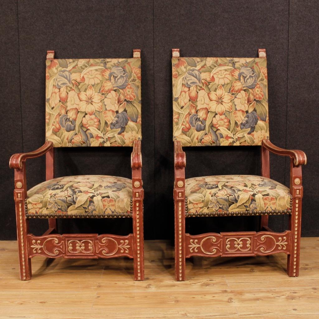 Pair of 20th century French armchairs. Carved and painted wooden furniture in Renaissance style of great size and impact. Hall or salon thrones of pleasant decor. Seats and backrests covered in floral fabric with some signs of wear (see photo), in