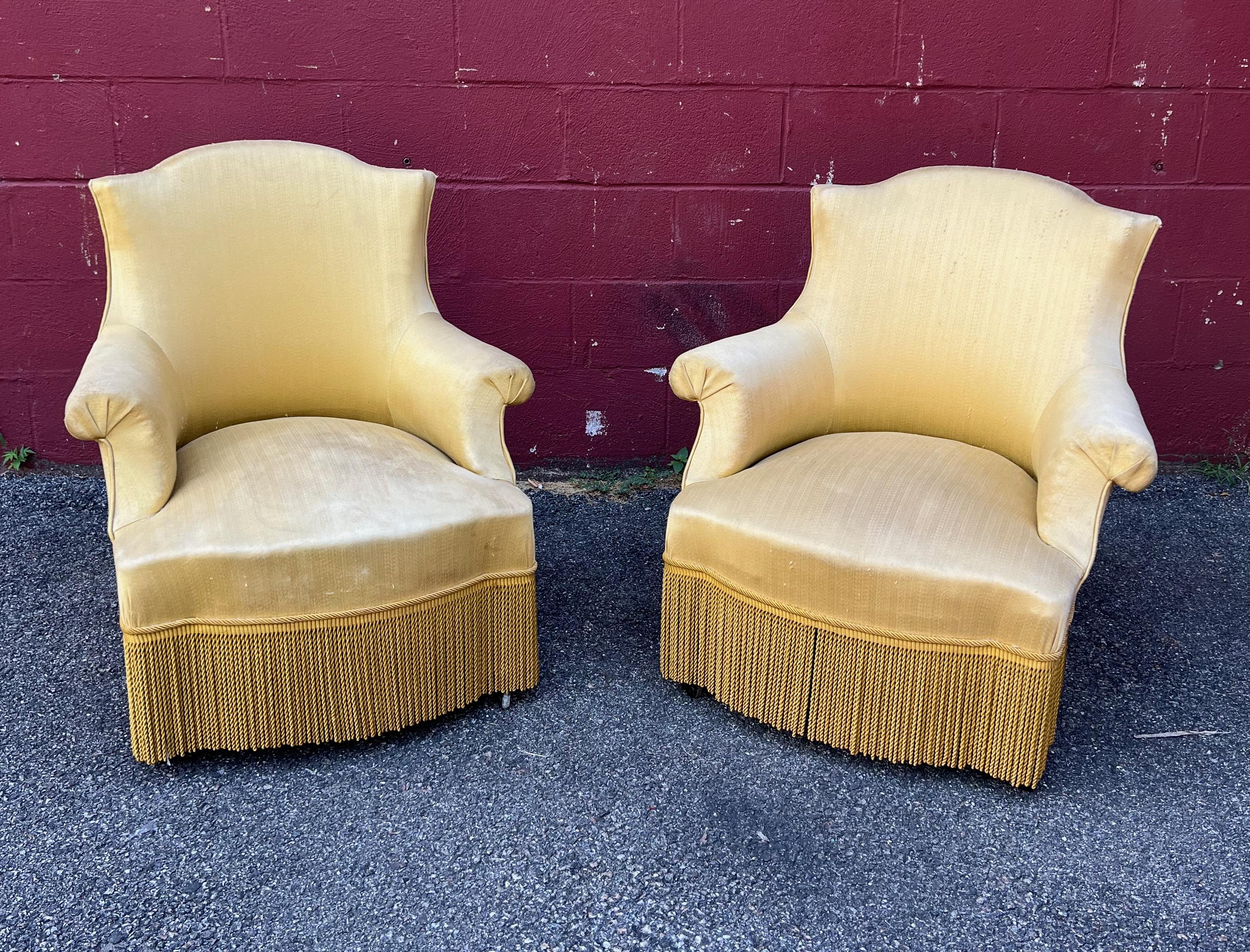 A classic pair of French Napoleon III armchairs in pale gold. Dating back to the 19th century, these authentic pieces embody classic Napoleon III style while providing an extra hint of modern luxury. Upholstered in a beautiful and subtle yellow/gold