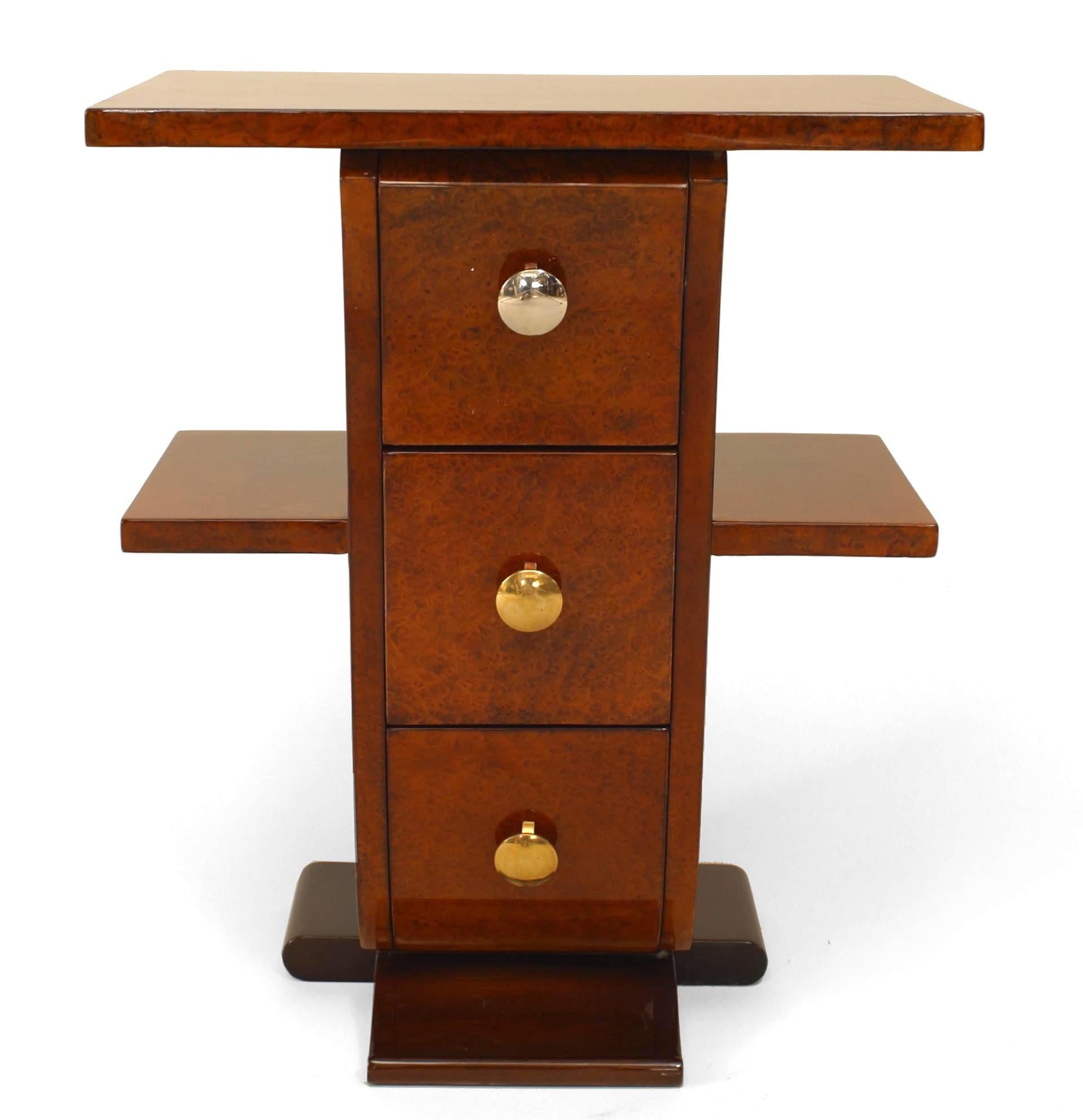 Pair of French Art Deco amboyna wood end tables with 3 drawers having chrome and brass drawer pulls and flanked by a Pair of shelves and resting on a mahogany base. (PRICED AS Pair)
