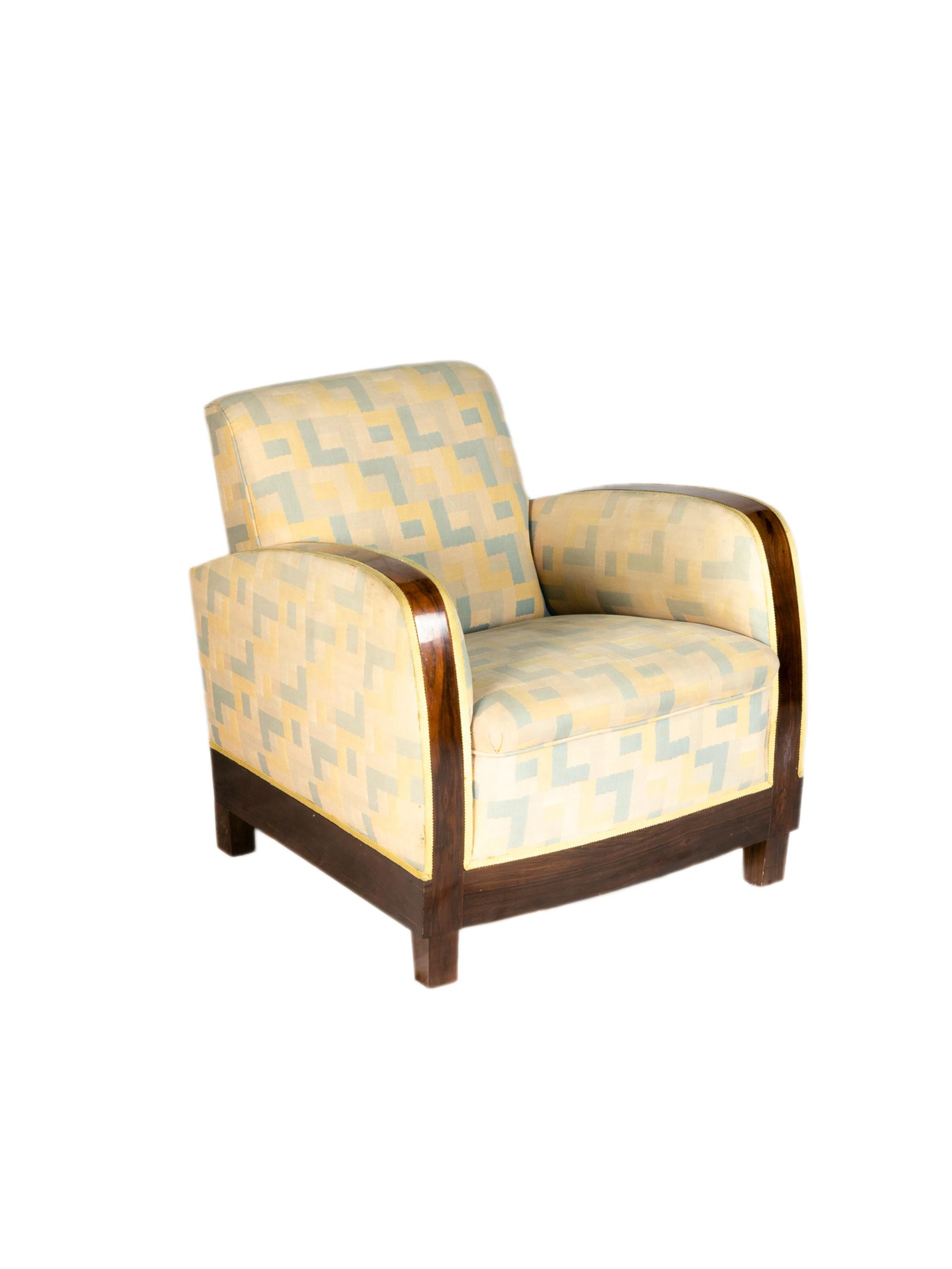 Elegant pair of varnished parquetry fauteuil sofas with elegant proportions and upholstery polychrome pattern of colors.

Both armchairs show signs of wear, with used springs and fabric.