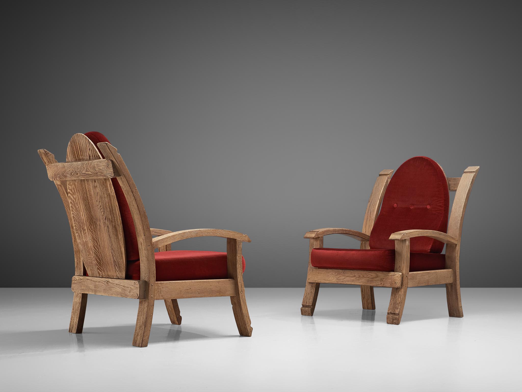Pair of lounge chairs, oak and fabric, France, 1940s

Charming French Art Deco armchairs made of oak. The design features bulky forms with elements of a throne, such as the high, almost majestic backrests that slightly leans backwards. The arms