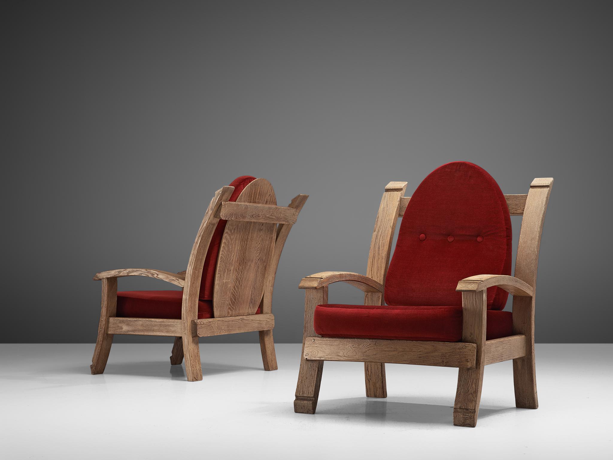 Pair of lounge chairs, oak and fabric, France, 1940s

Charming French Art Deco armchairs made of oak. The design features bulky forms with elements of a throne, such as the high, almost majestic backrests that slightly leans backwards. The arms