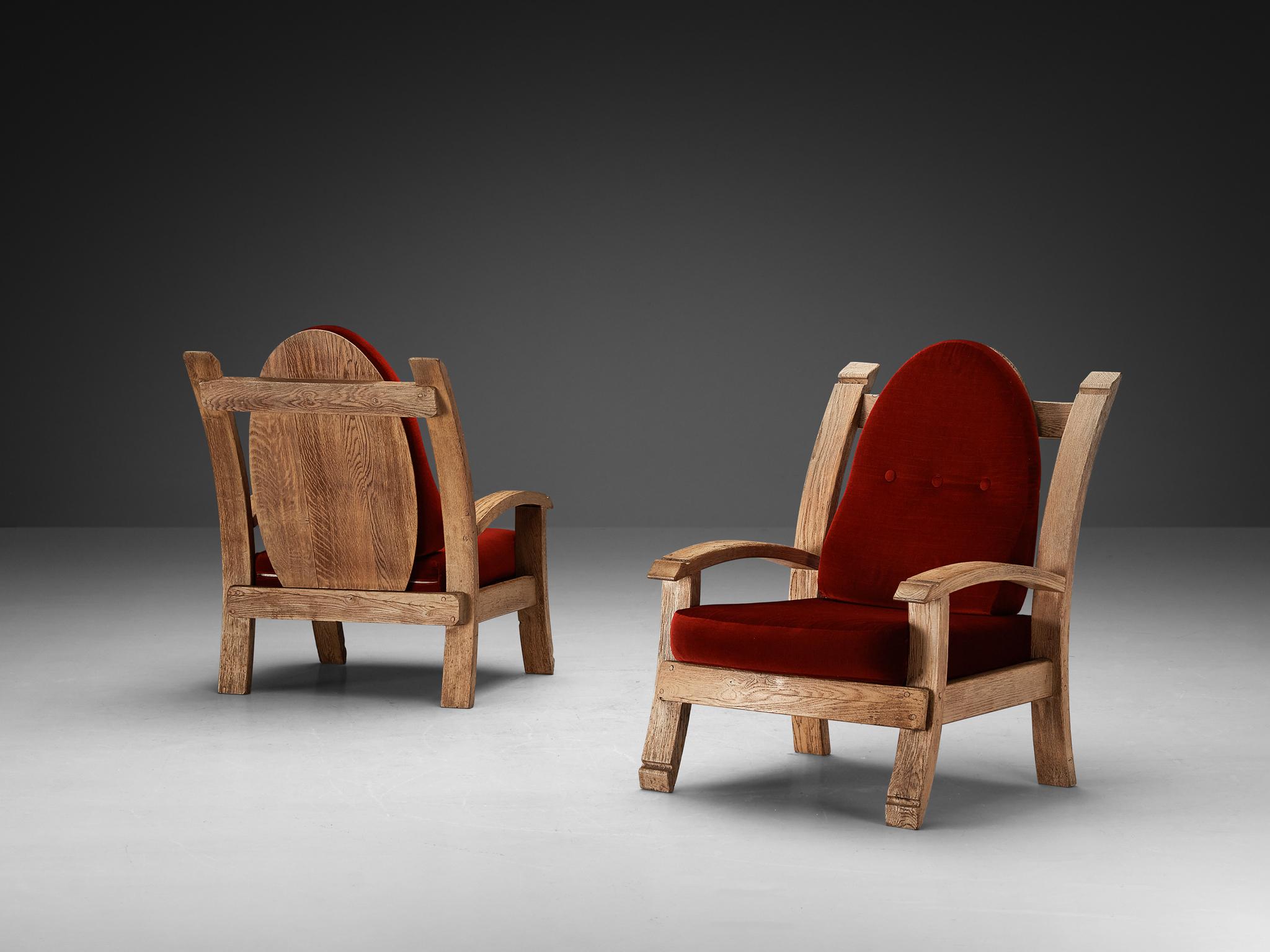 Pair of lounge chairs, oak and fabric, France, 1940s

Charming French Art Deco armchairs made of oak. The design features bulky forms with elements of a throne, such as the high, almost majestic backrests that slightly leans backwards. The arms