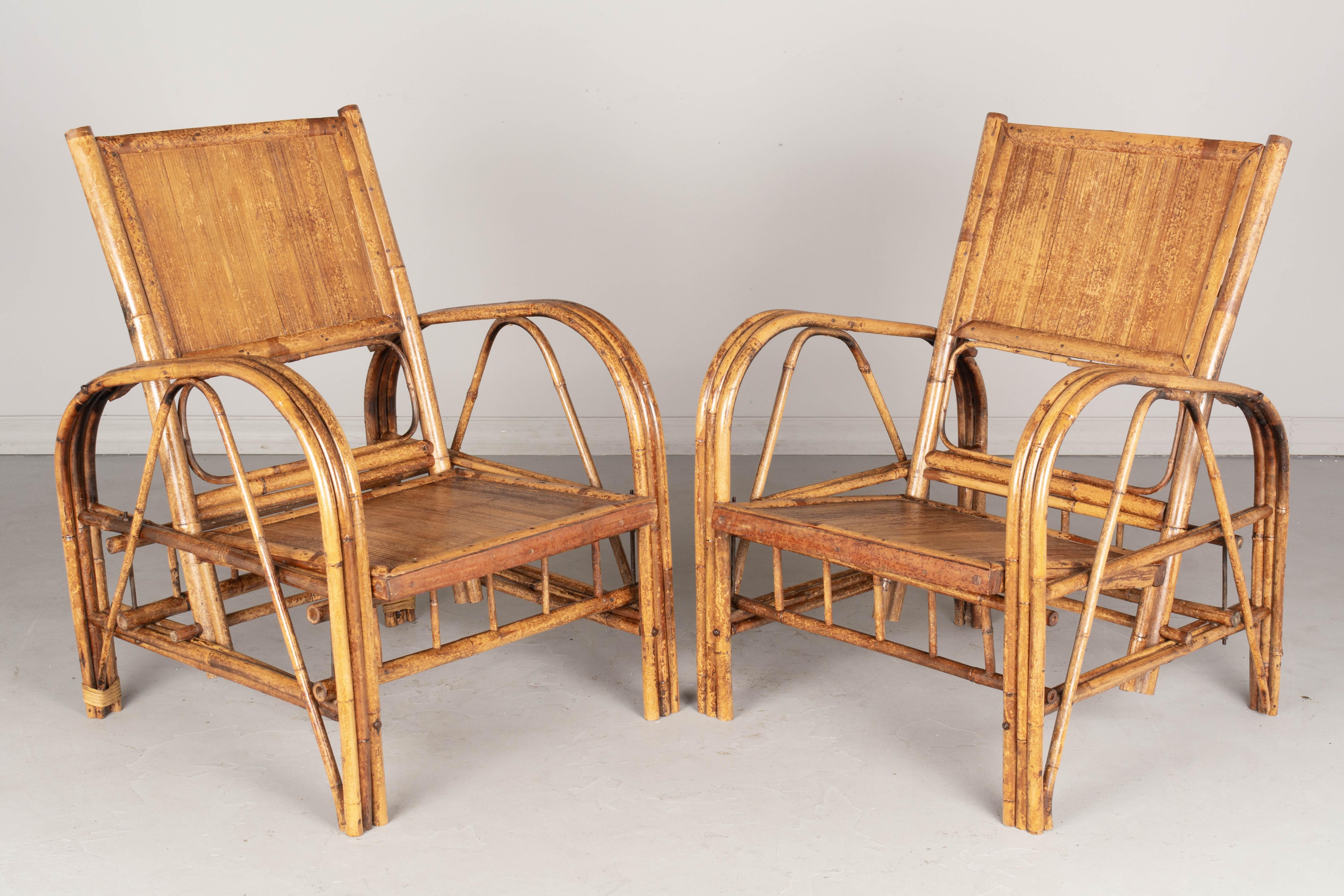 A pair of French Art Deco bamboo lounge or club chairs. Sturdy hand-crafted chairs with removable seat and back. No cushions. Casual boho California style, perfect for living room, sunroom or lanai. Please refer to photos for more details. Pictures